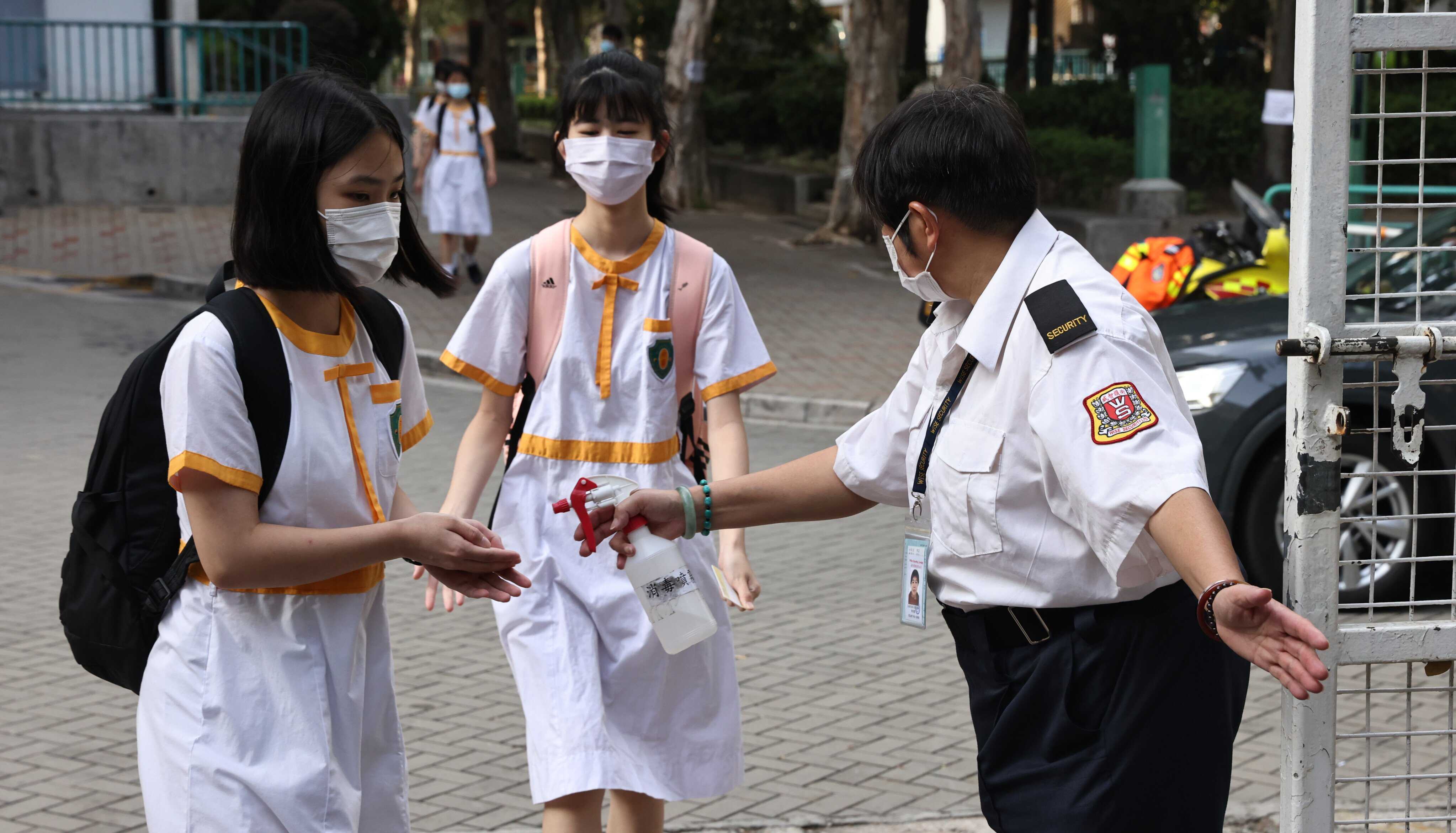 Hong Kong school meets Covid vaccine target, returns to full-day ...