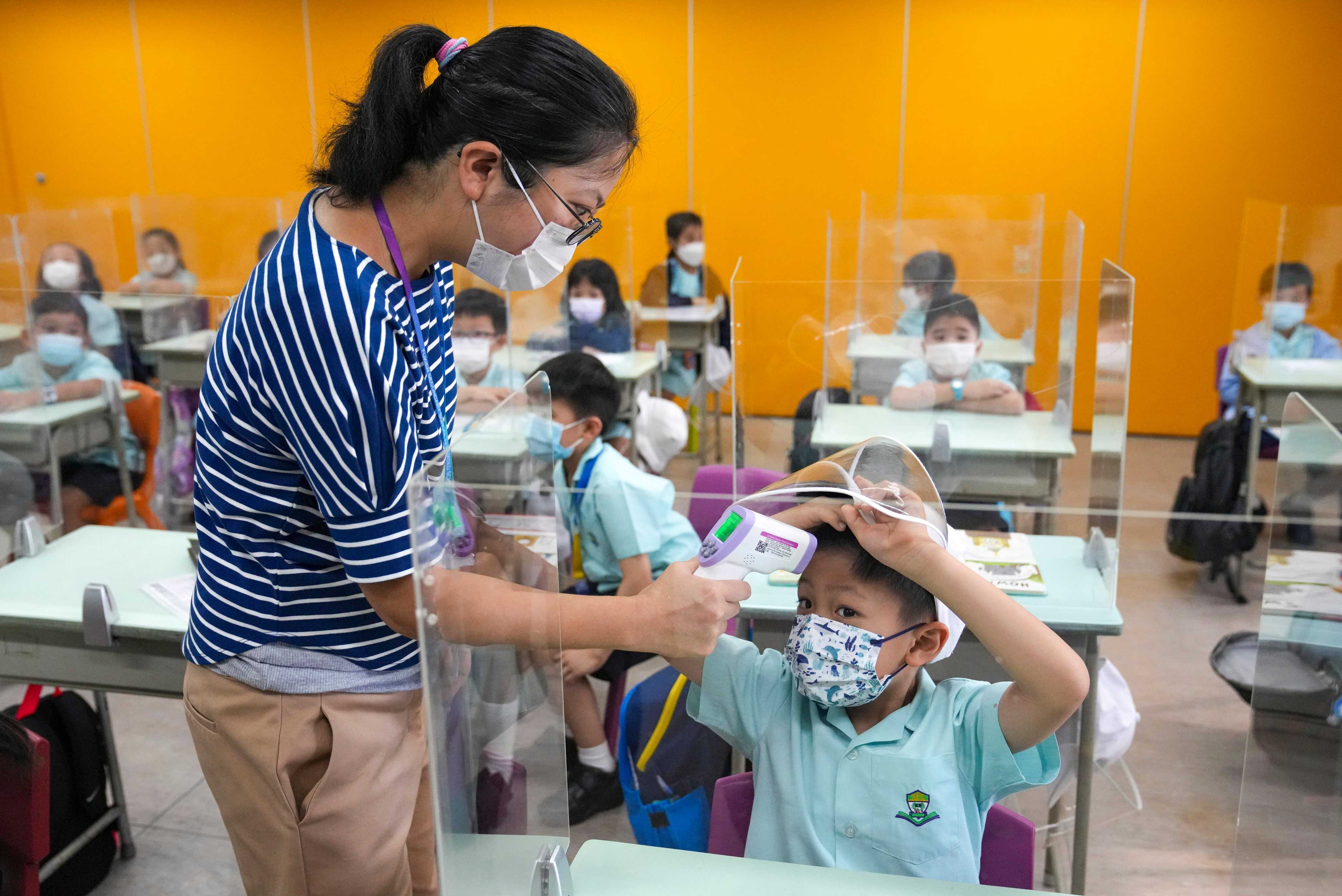 Coronavirus: Hong Kong students head back to school as stricter Covid ...