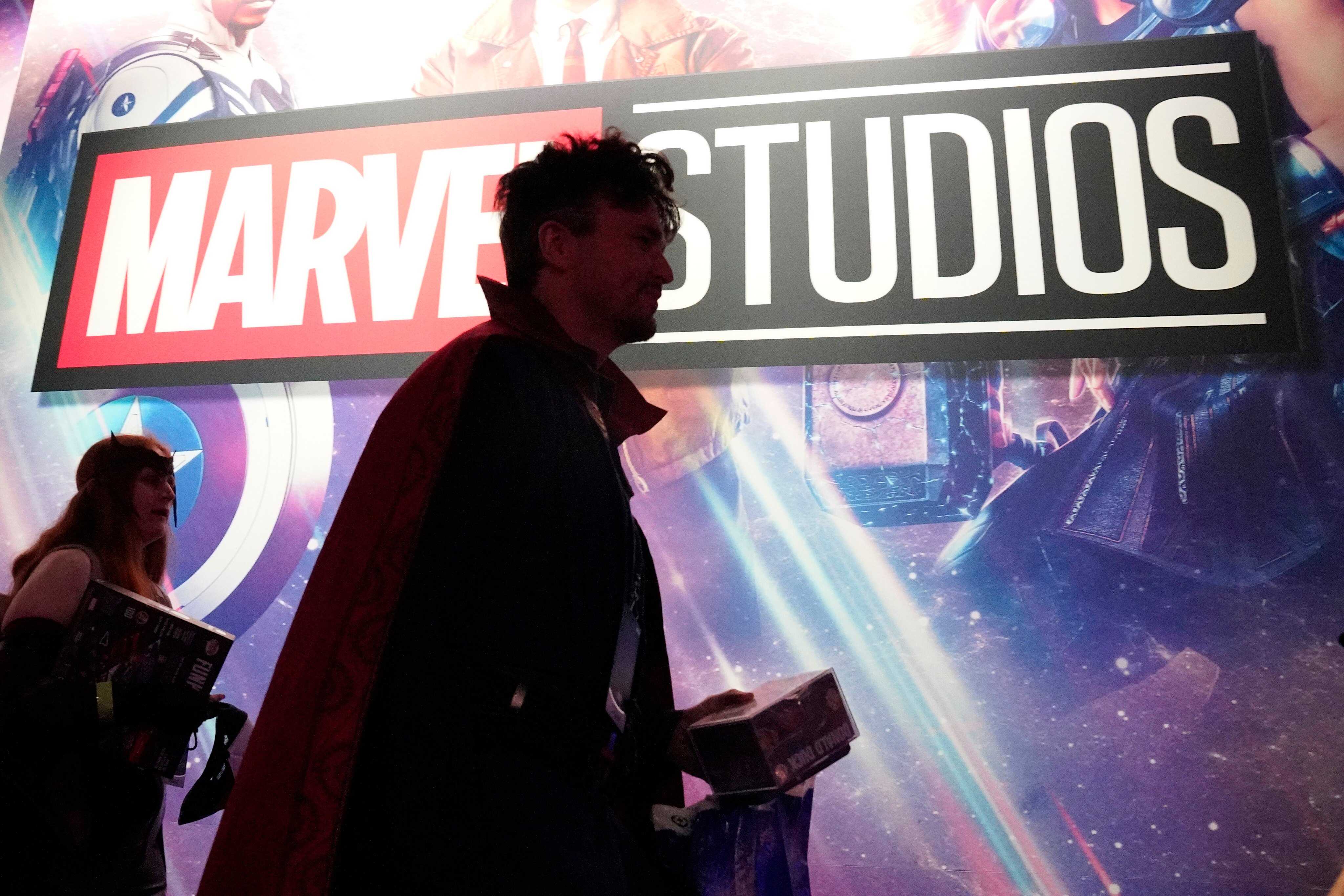 A cosplayer dressed as Doctor Strange passes by a Marvel Studios exhibit at the D23 Expo on Saturday. Photo: AP