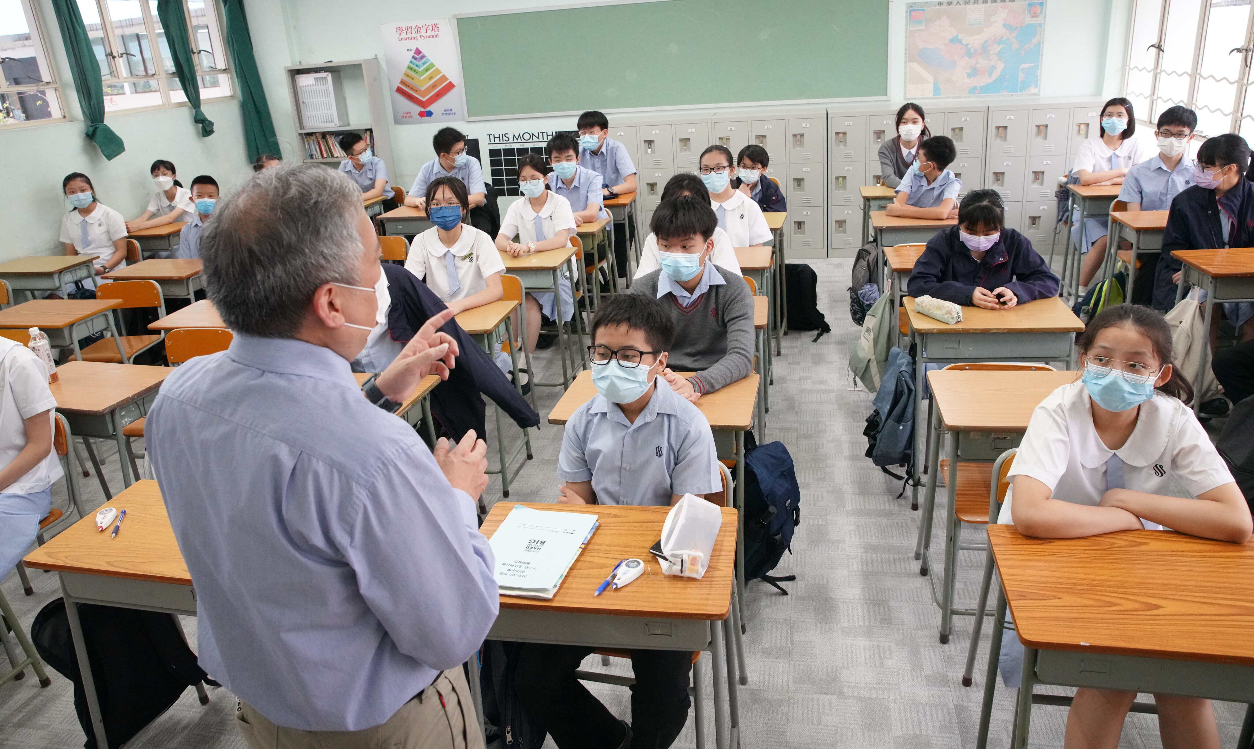 Students attend their first day of the new academic year at Scientia Secondary School, Ho Man Tin. Secondary school heads have warned that the loss of teachers is affecting students. Photo: Winson Wong