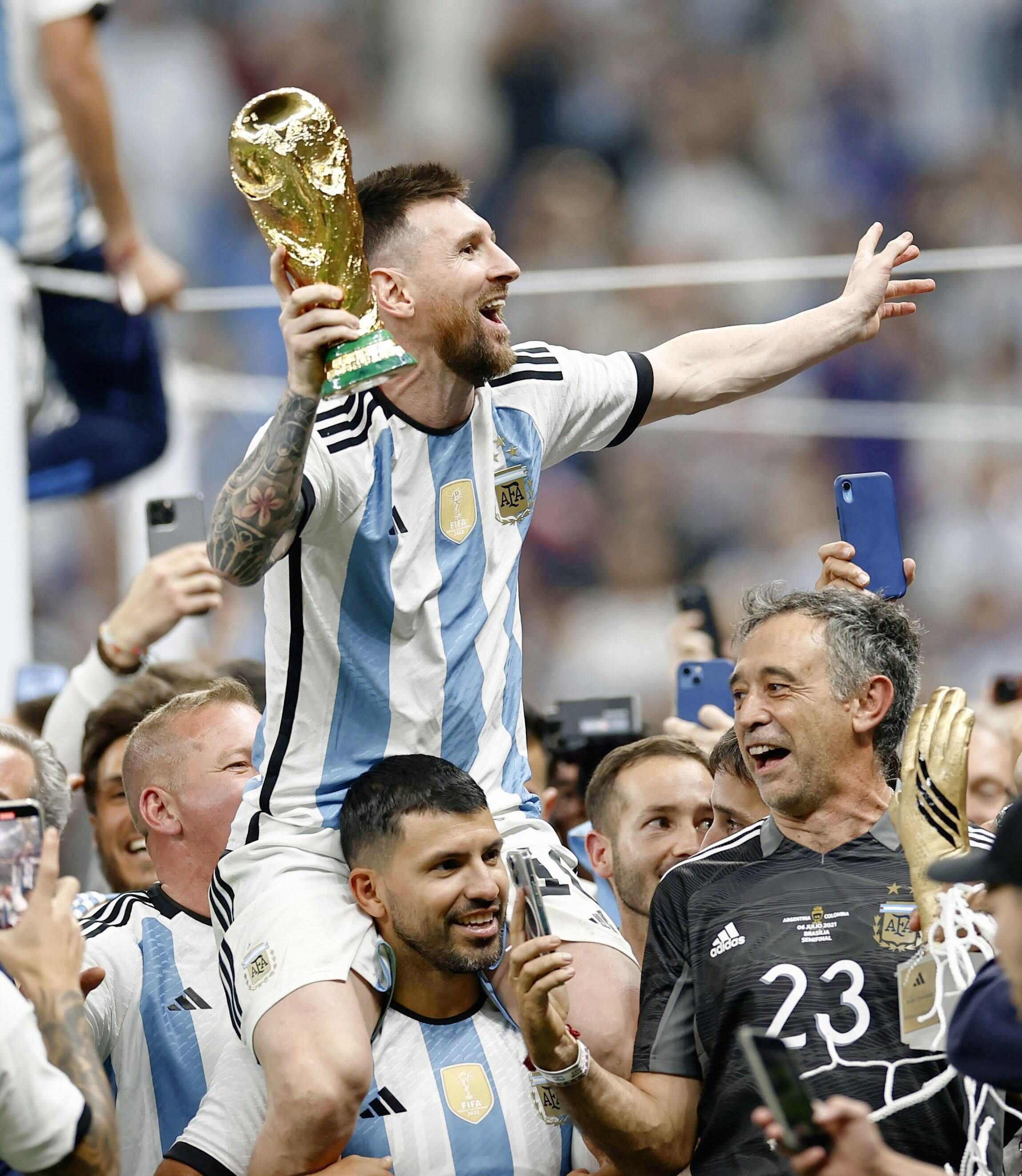 Argentina’s Lionel Messi celebrates with the trophy after the national team beat France in the Fifa World Cup football final at Lusail Stadium in Qatar. Photo: Kyodo