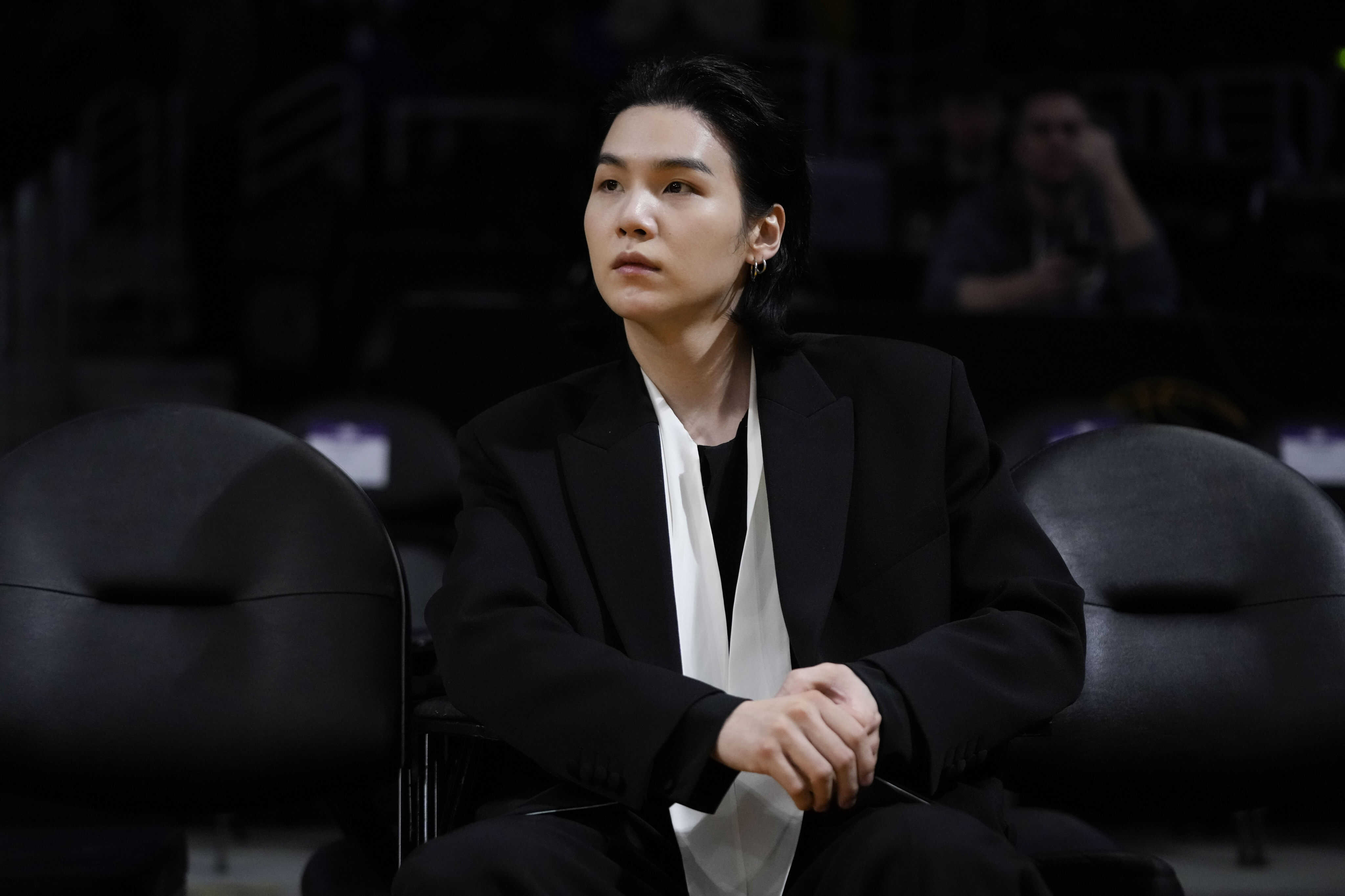 BTS member Suga attends an NBA basketball game between the Los Angeles Lakers and the Dallas Mavericks on January 12, 2023 in Los Angeles. Suga has become the third member of BTS to begin South Korea’s compulsory military service. Photo: AP