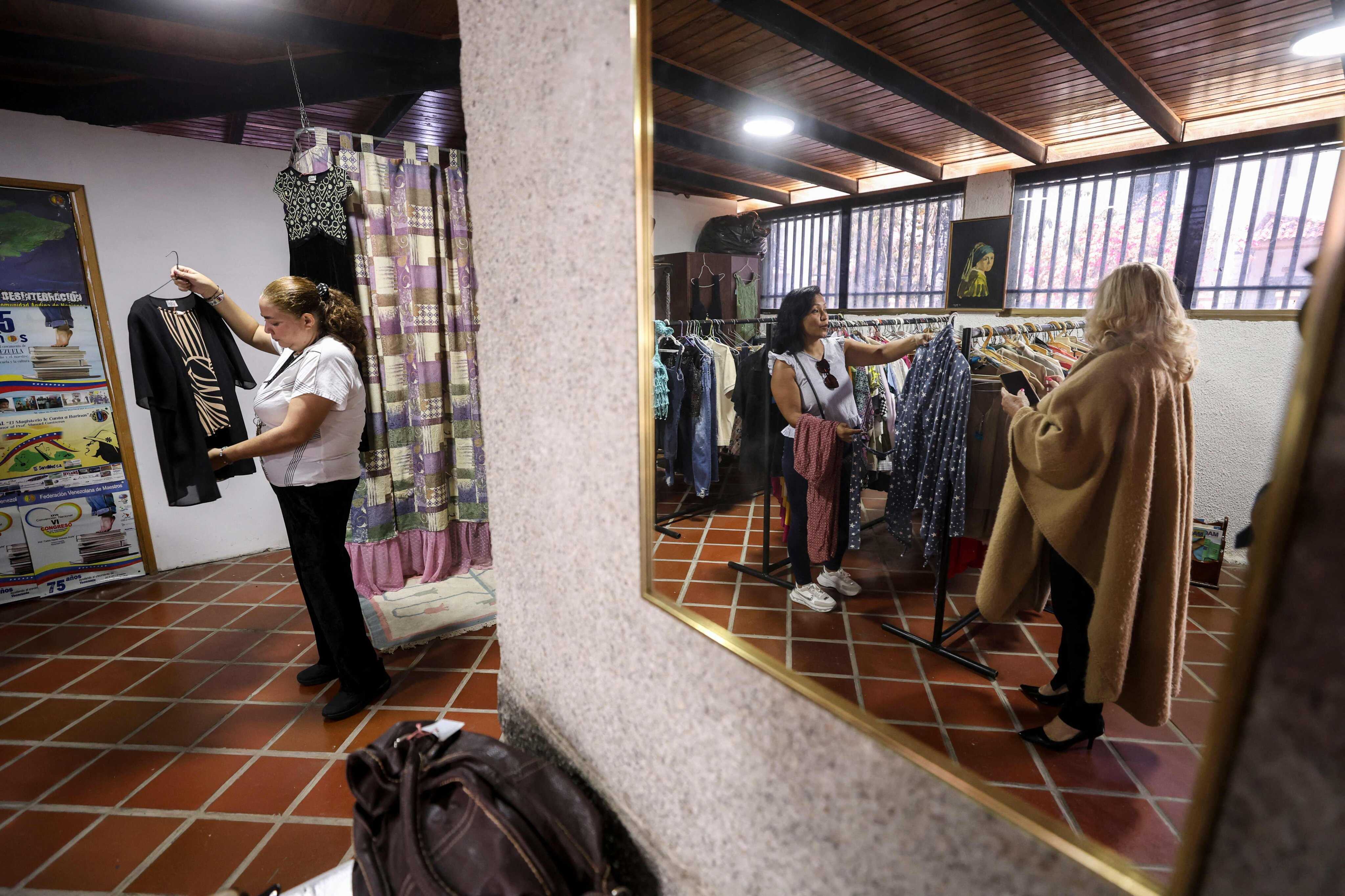 The El Ropero Solidario thrift store  provides financial assistance to educators while fostering community support through donated clothing. Photo: AFP
