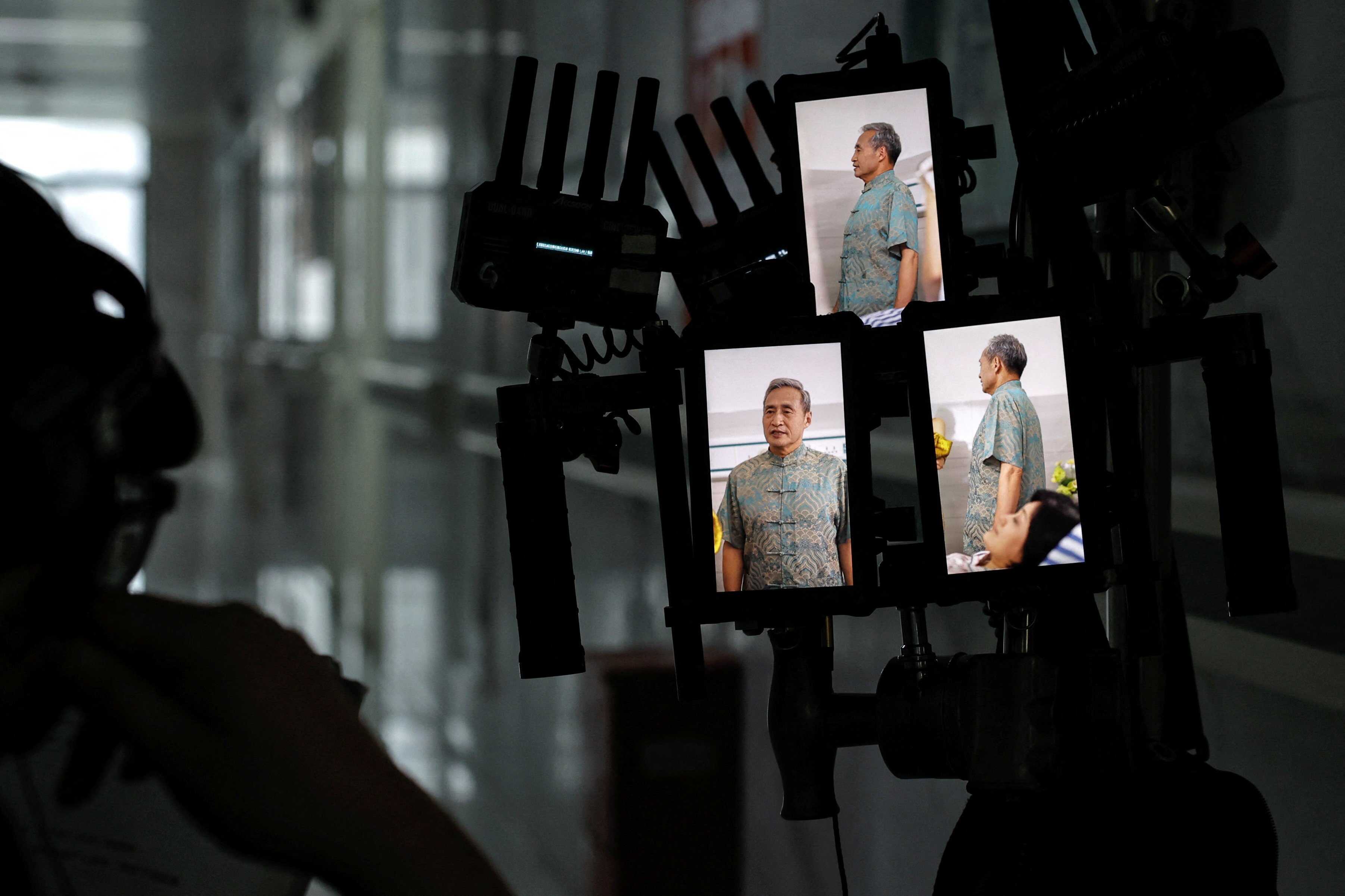 A director monitors vertical screens on the set of a micro drama during a filming session at a hospital in Zhengzhou, Henan province, China. Photo: Reuters