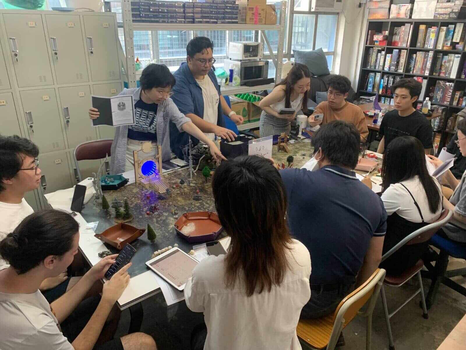 Gus Melzar Casela Geopano (top row, third from left) hosts ‘Dungeons & Dragons’ sessions at a hobby store called DMZ. Photo: Handout