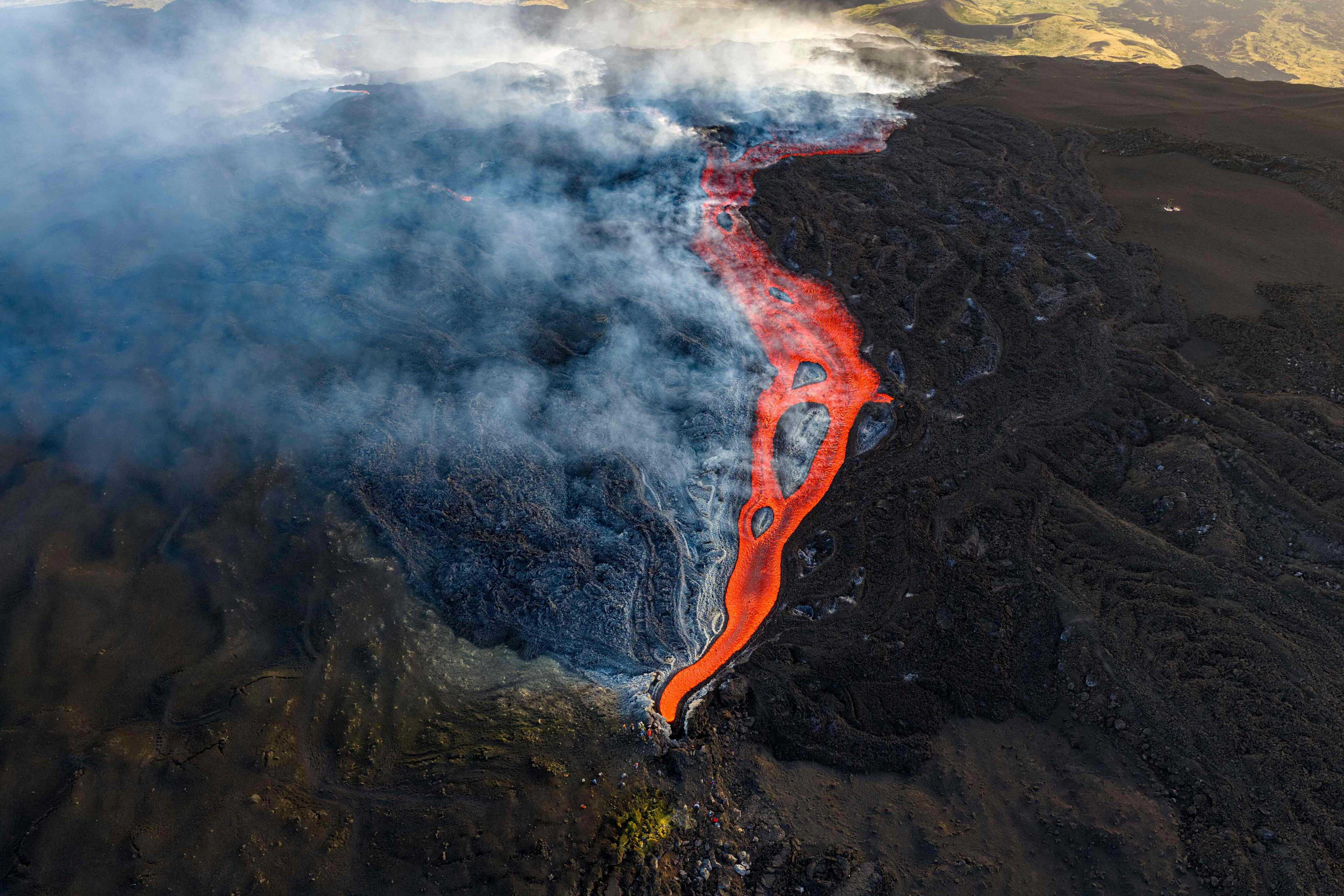 This aerial view shows a flow of lava from Mount Etna, a stratovolcano in Italy. Photo: AFP
