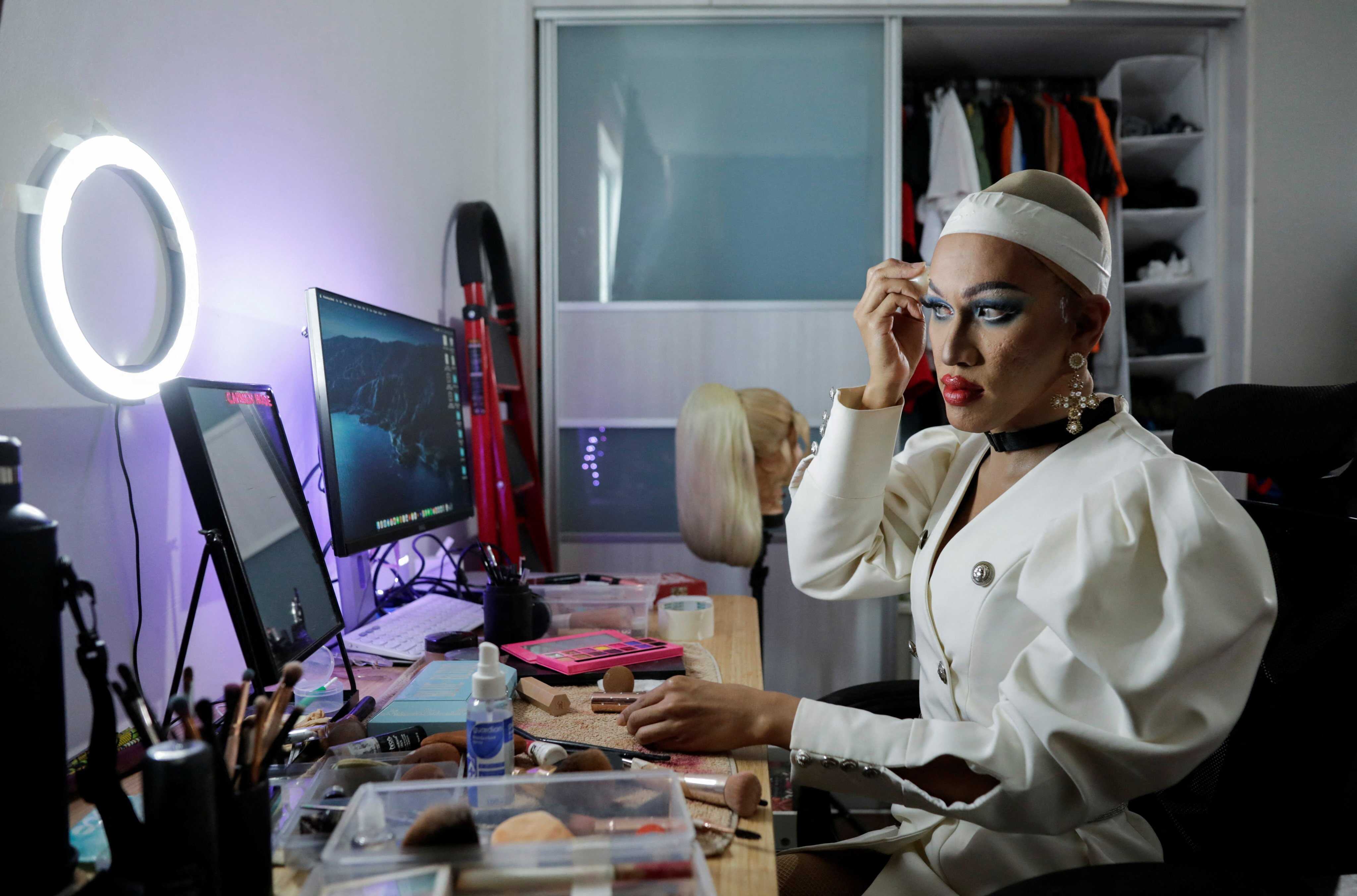 Malaysian drag queen Carmen Rose, who declined to disclose her non-drag identity due to fears of reprisal, puts on make-up. Photo: Reuters
