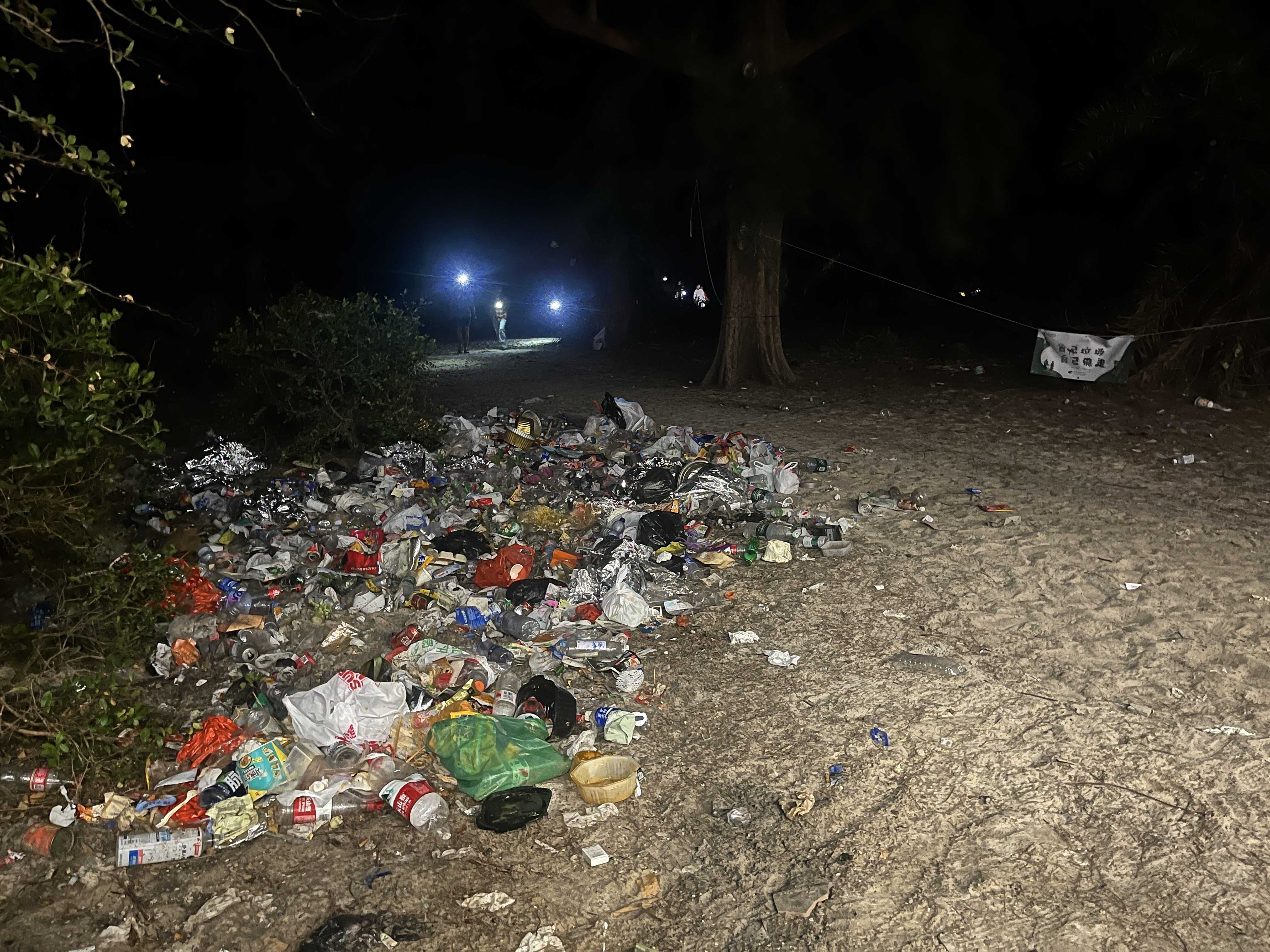 On December 20, hundreds of people descended on Ham Tin beach, leaving a trail of trash despite signs from authorities urging people to handle their own garbage. Photo: Kelly Fung