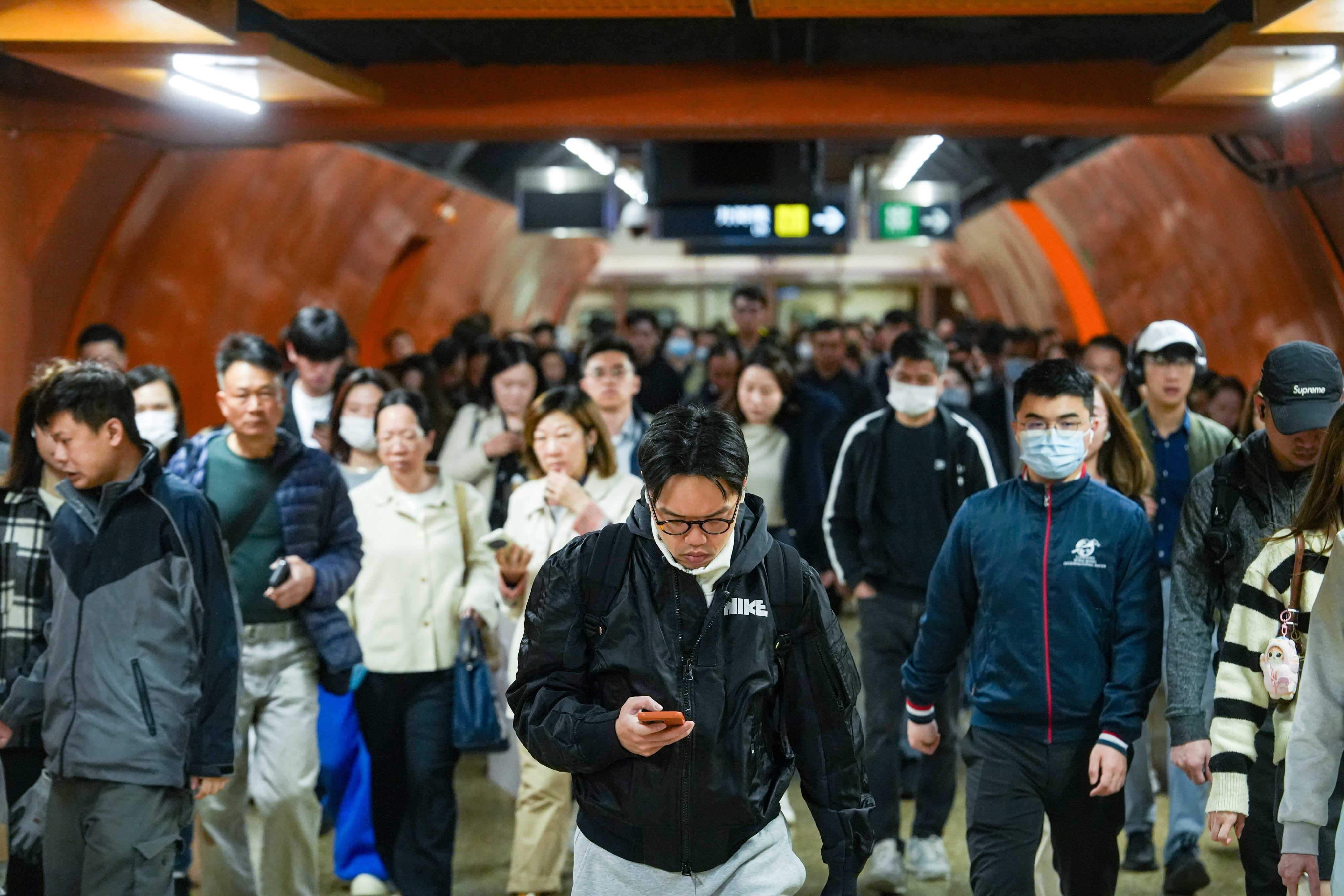 Morning commuters, many on their way to work, in North Point. Photo: Sun Yeung