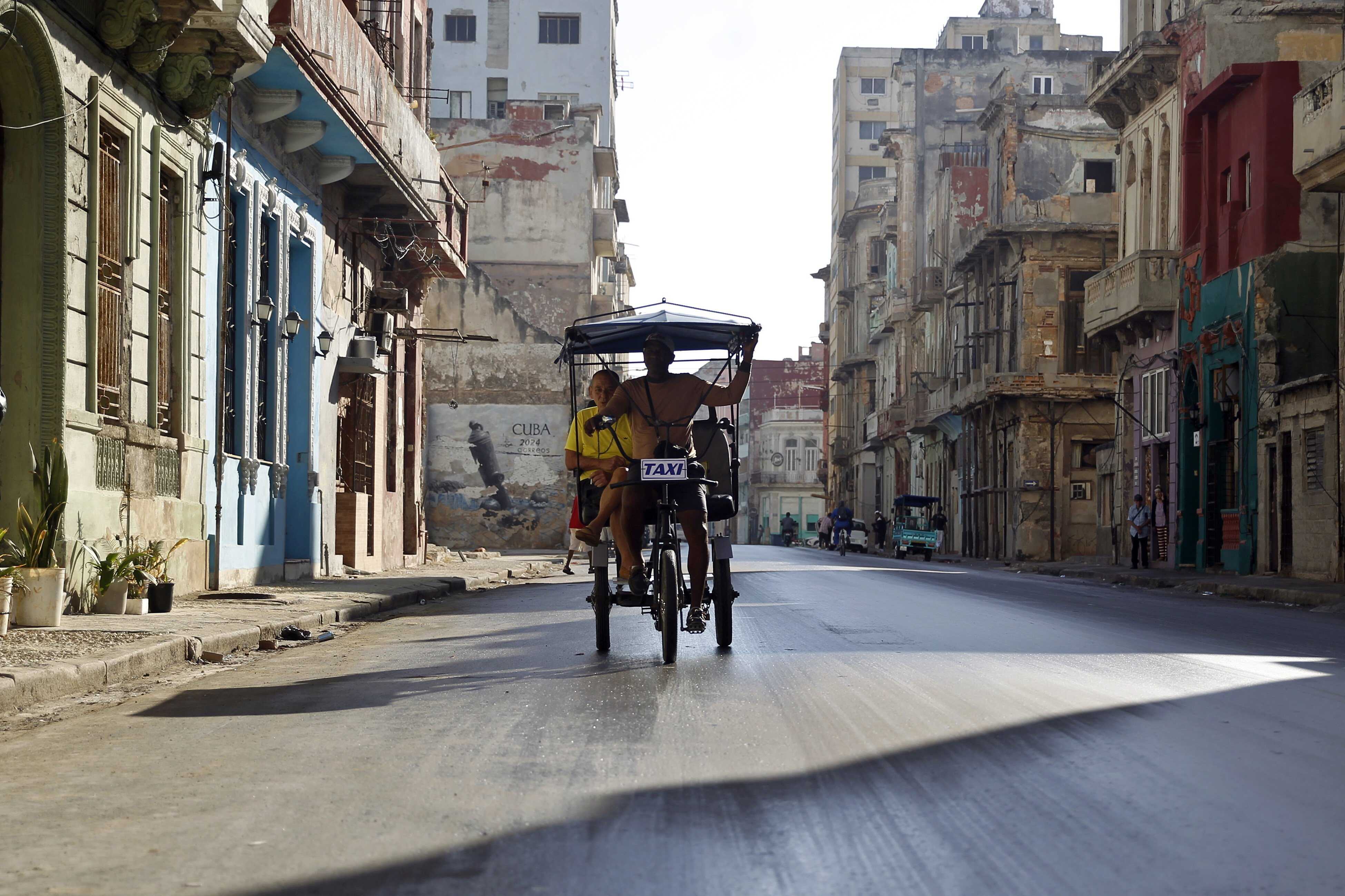 As Havana faces a severe fuel crisis because of US sanctions, many people are turning to bikes. Photo: EPA-EFE