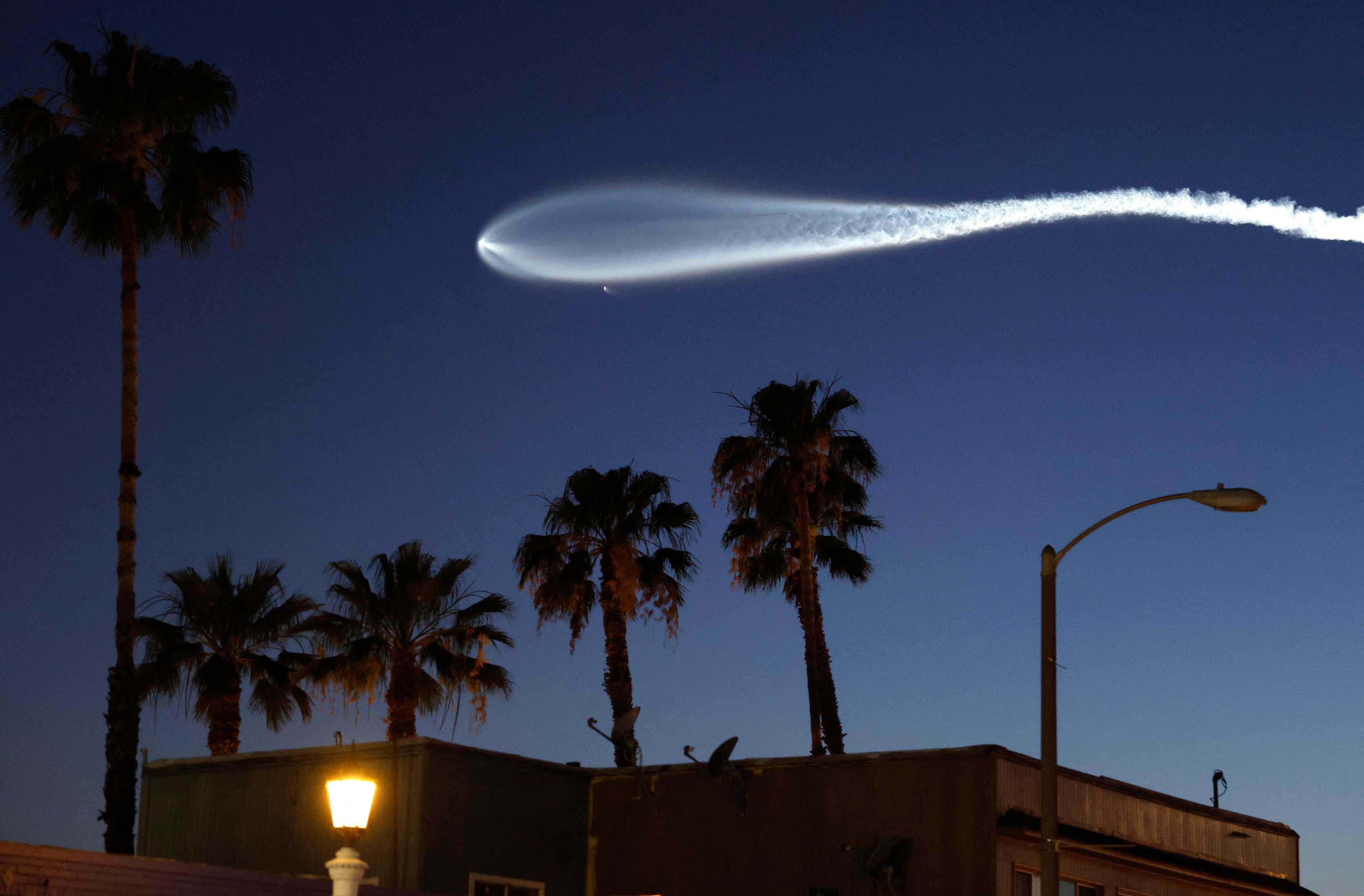 A SpaceX Falcon 9 rocket, carrying 25 Starlink internet satellites, rises after launching from Vandenberg Space Force Base on April 6, 2026. Photo: Getty Images via AFP
