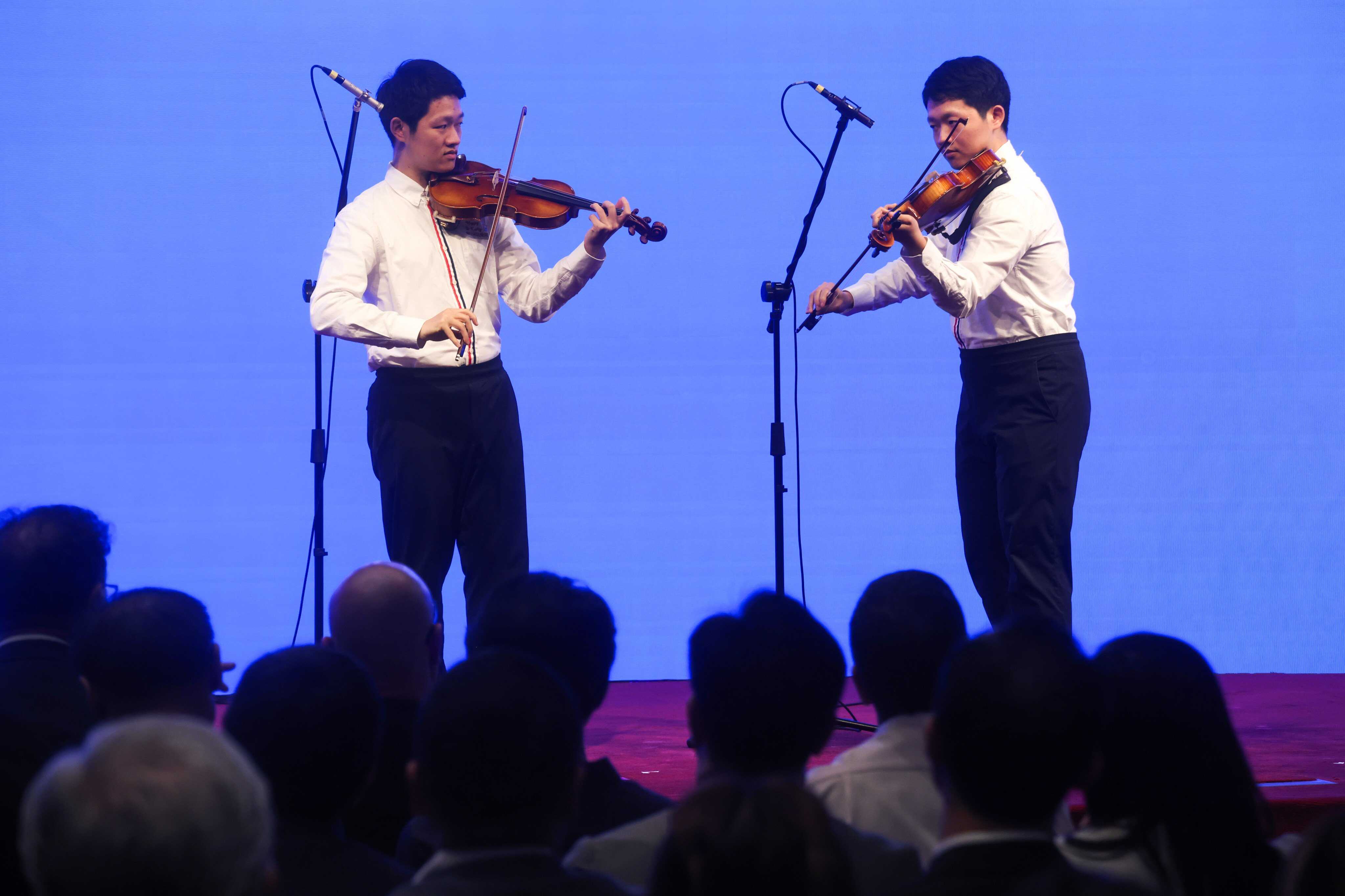 Brothers Jayden (left) and Hugo Pang perform on World Autism Awareness Day 2026. Photo: Jonathan Wong