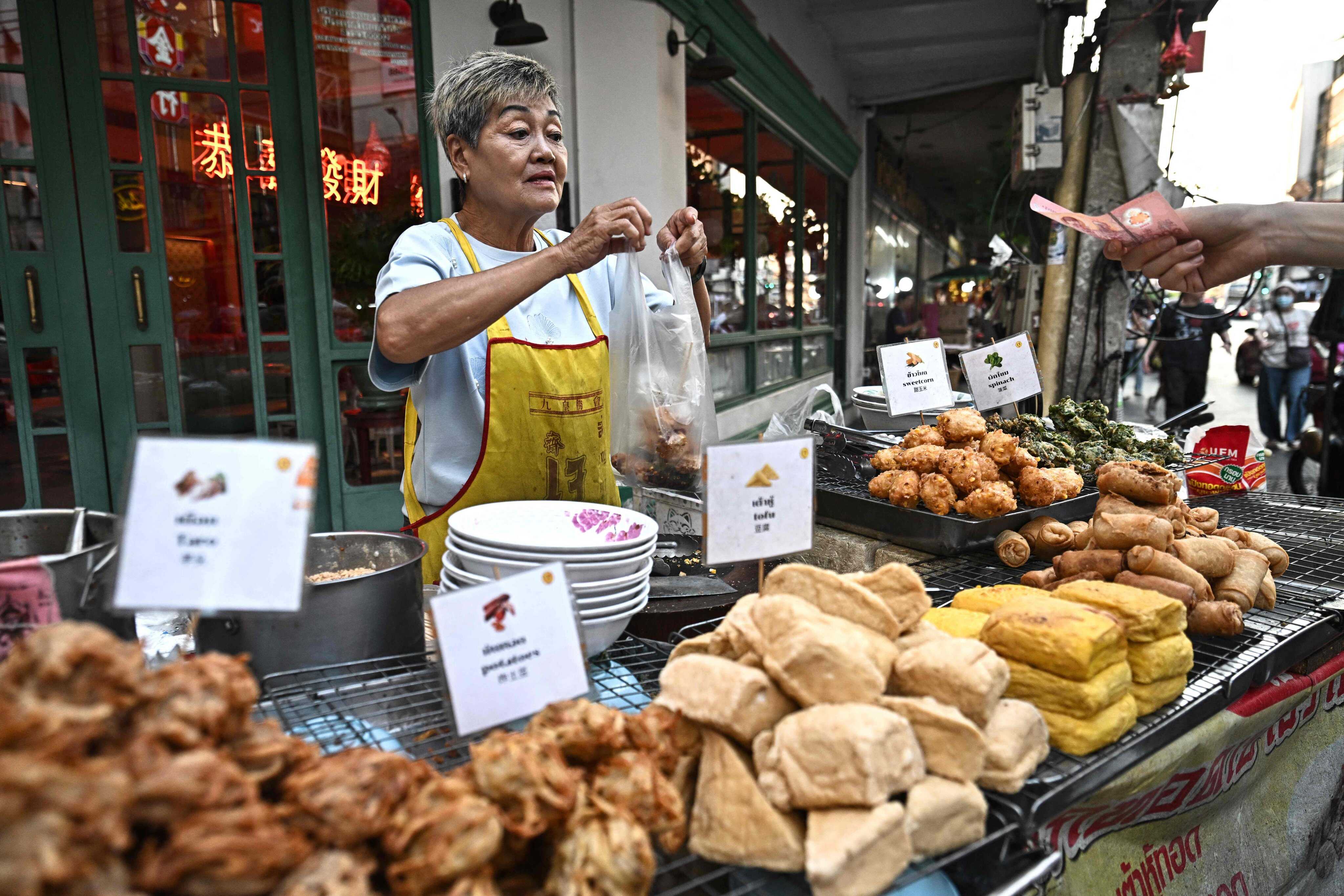 Bangkok’s iconic street food scene faces an uncertain future as the city’s clean-up efforts displace vendors, impacting livelihoods and culinary culture. Photo: AFP