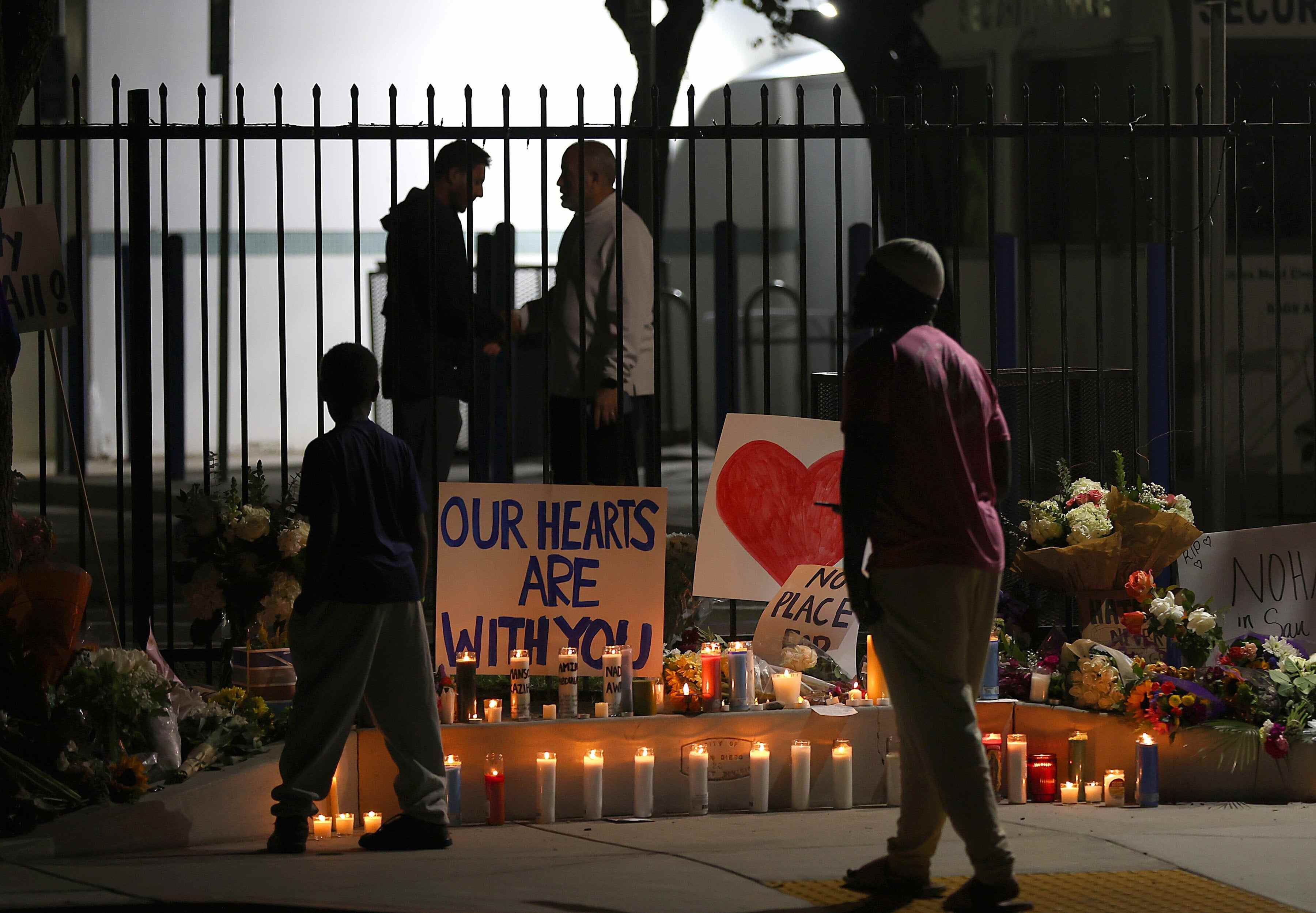 A tribute of candles is placed in front of the centre’s gates following a vigil at the Islamic Centre of San Diego in the US state of California. Photo: EPA