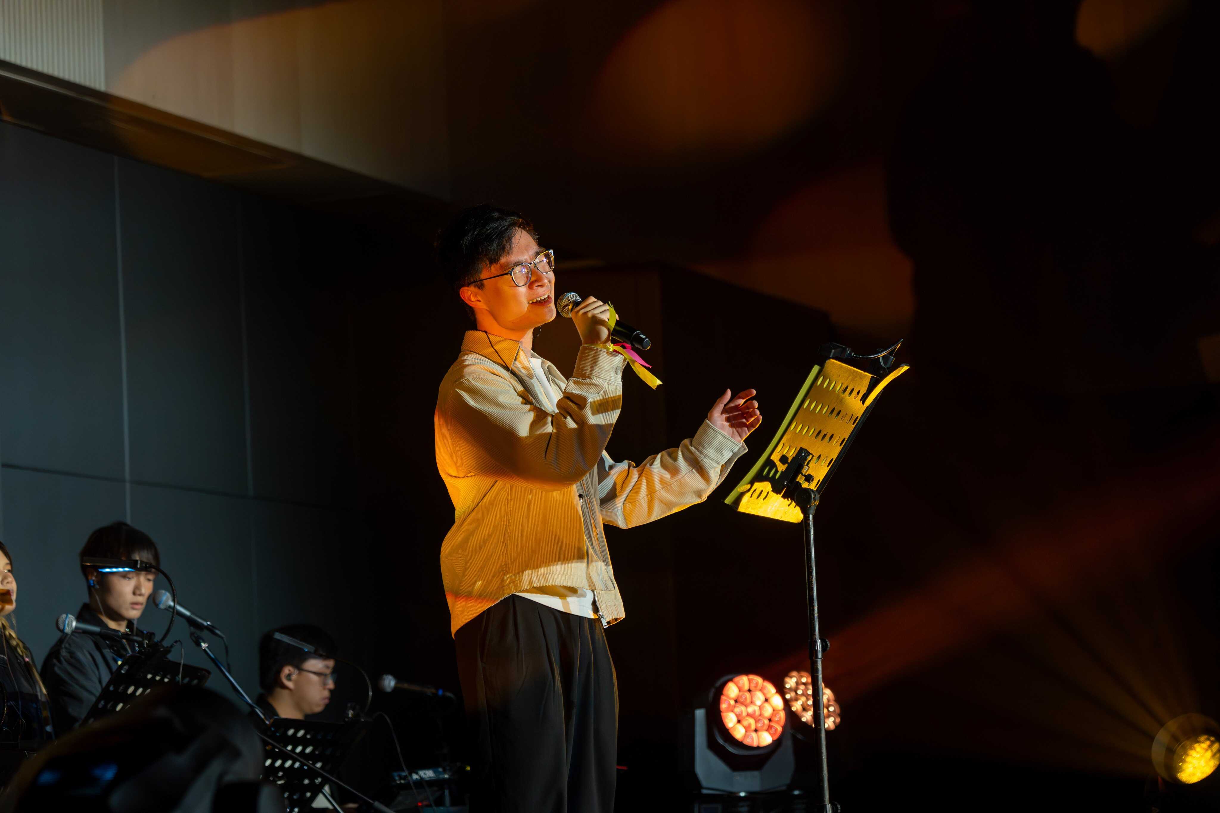 Daniel Chan King-lok presents his song “Kiu Je (嬌姐)”, which he wrote about his grandmother. Photo: Hong Kong Metropolitan University
