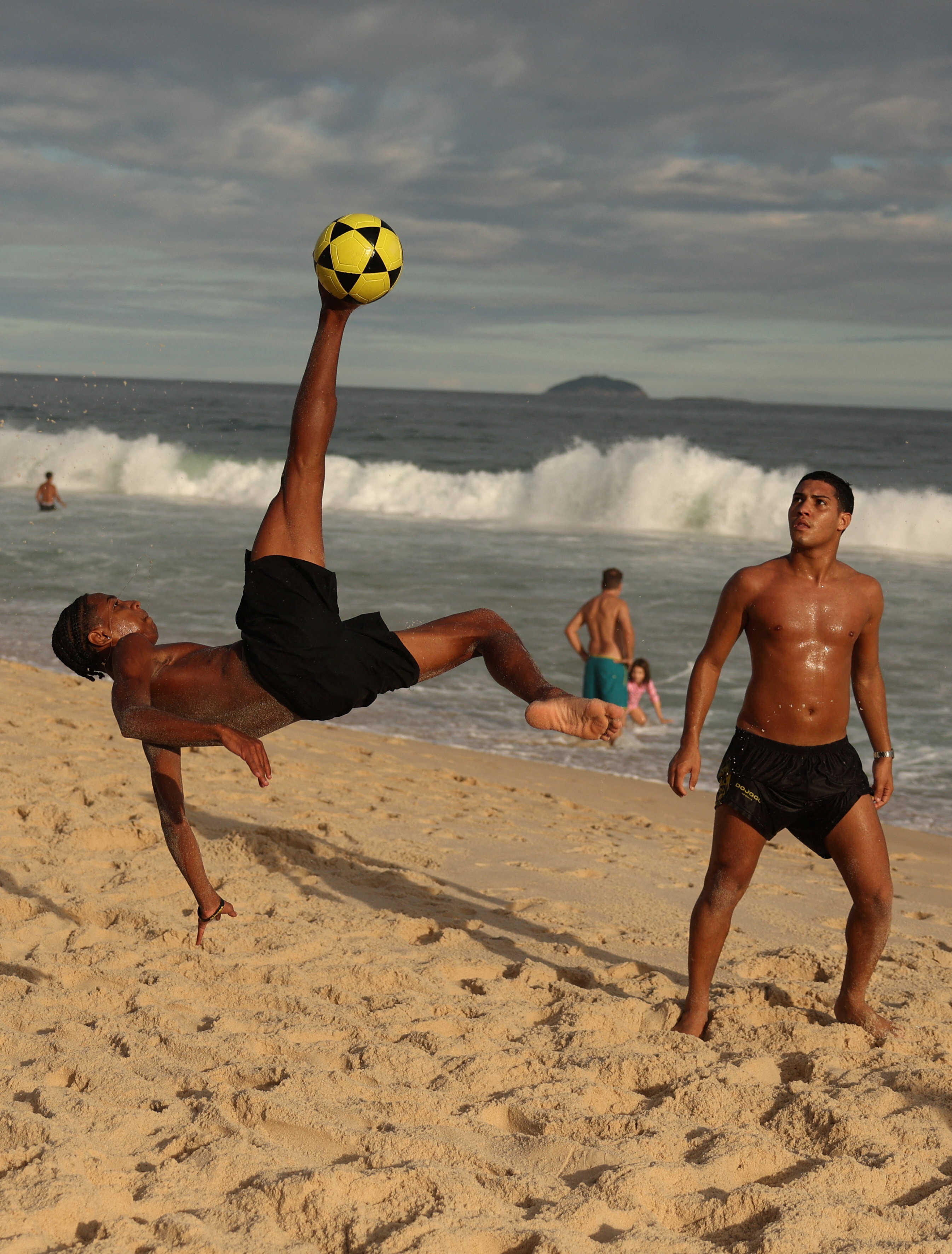 Young people play “altinha”, a Brazilian game where players gather and keep a ball in the air without using their hands, in Rio de Janeiro, Brazil. Photo: Reuters