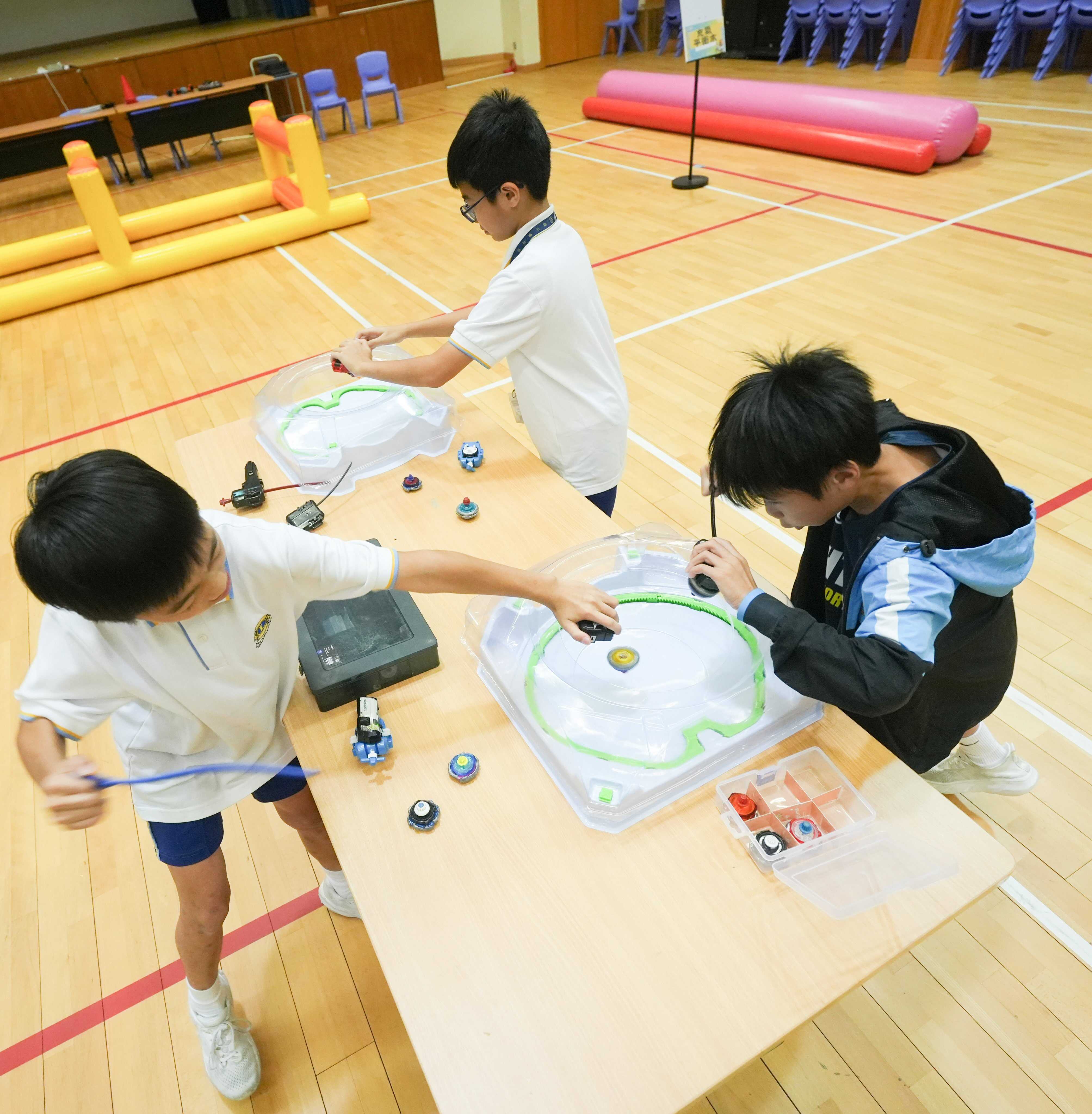 Students compete in Beyblade battles at Lions Clubs International Ho Tak Sum Primary School in Tin Shui Wai. Photo: Sun Yeung