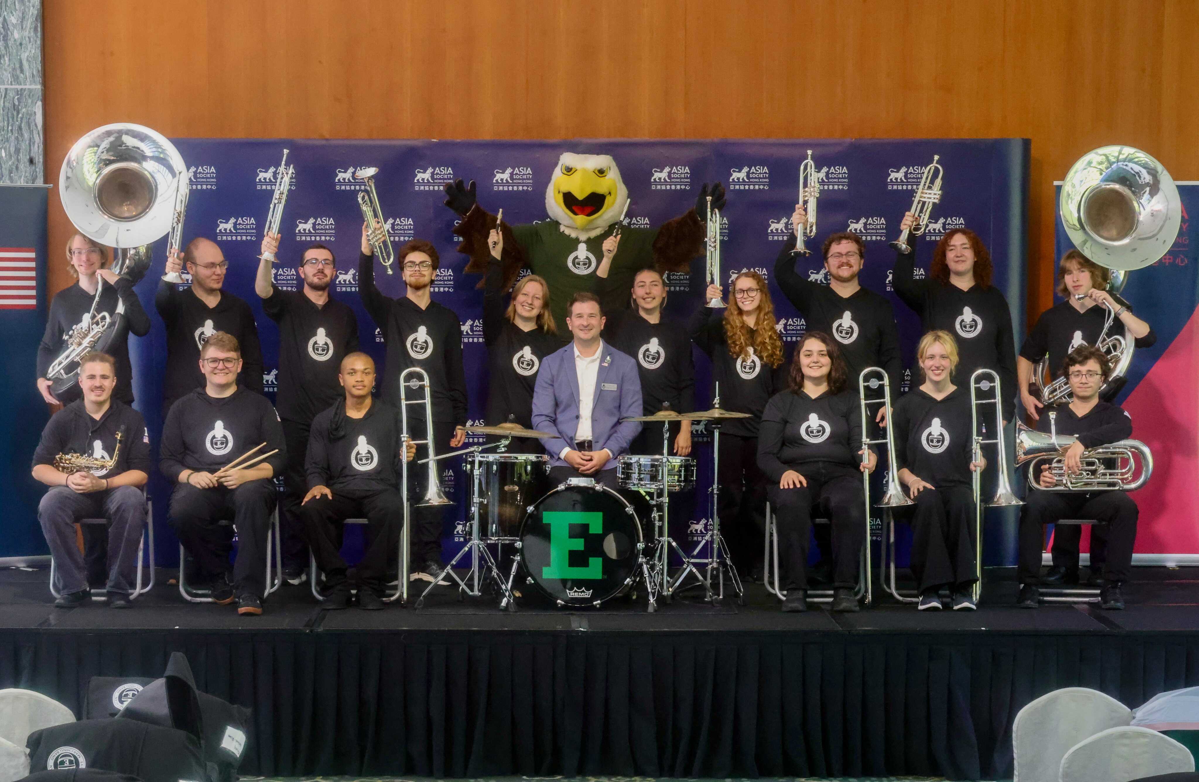 Nick Smith (centre), associate director of bands for the School of Music and Dance at Eastern Michigan University, poses with members of the marching band and the university’s mascot at Asia Society Hong Kong. Photo: Jonathan Wong