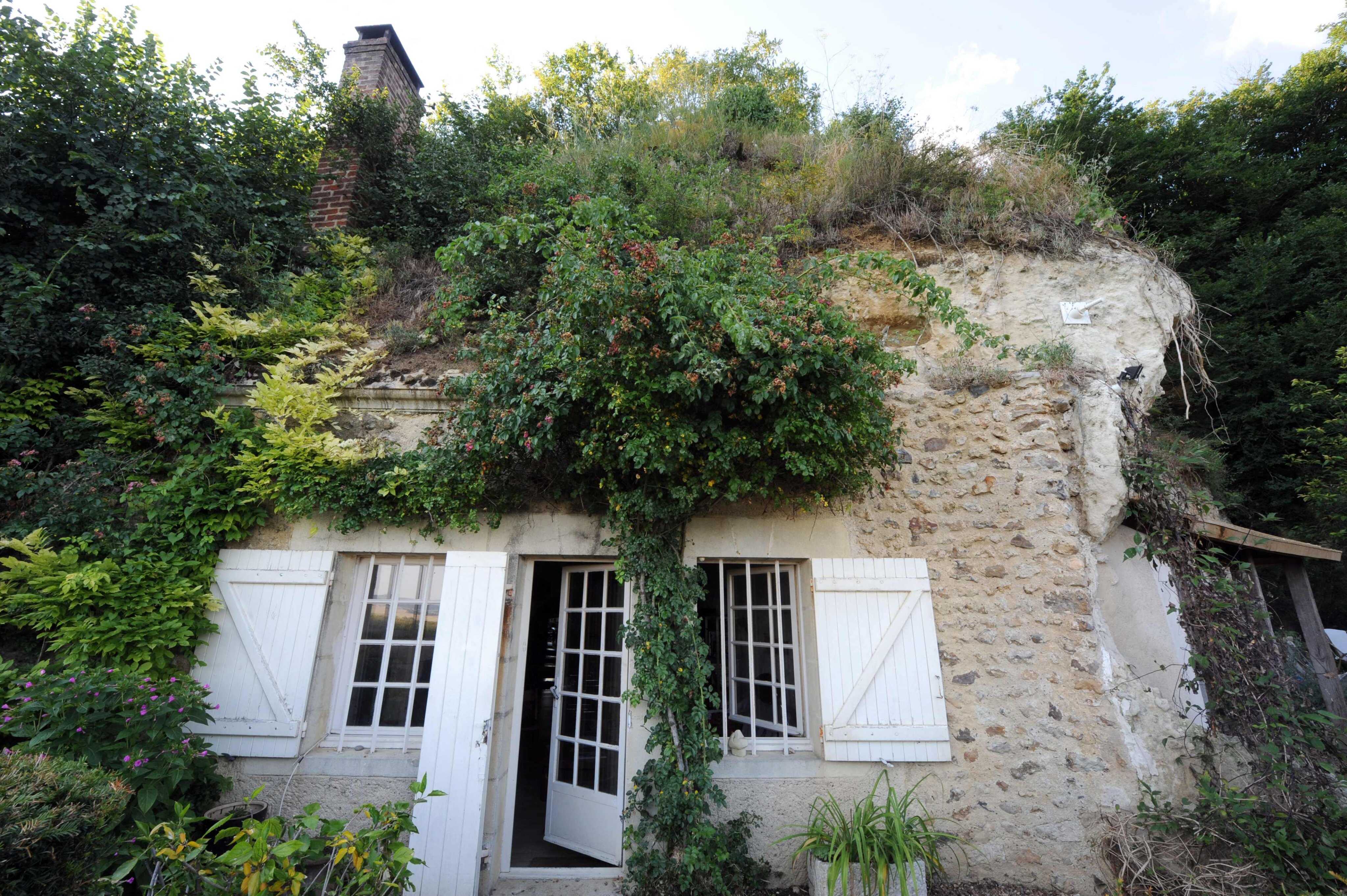 Houses carved into the rock in Troo, France offer energy-efficient alternatives for beating the heat. Photo: AFP
