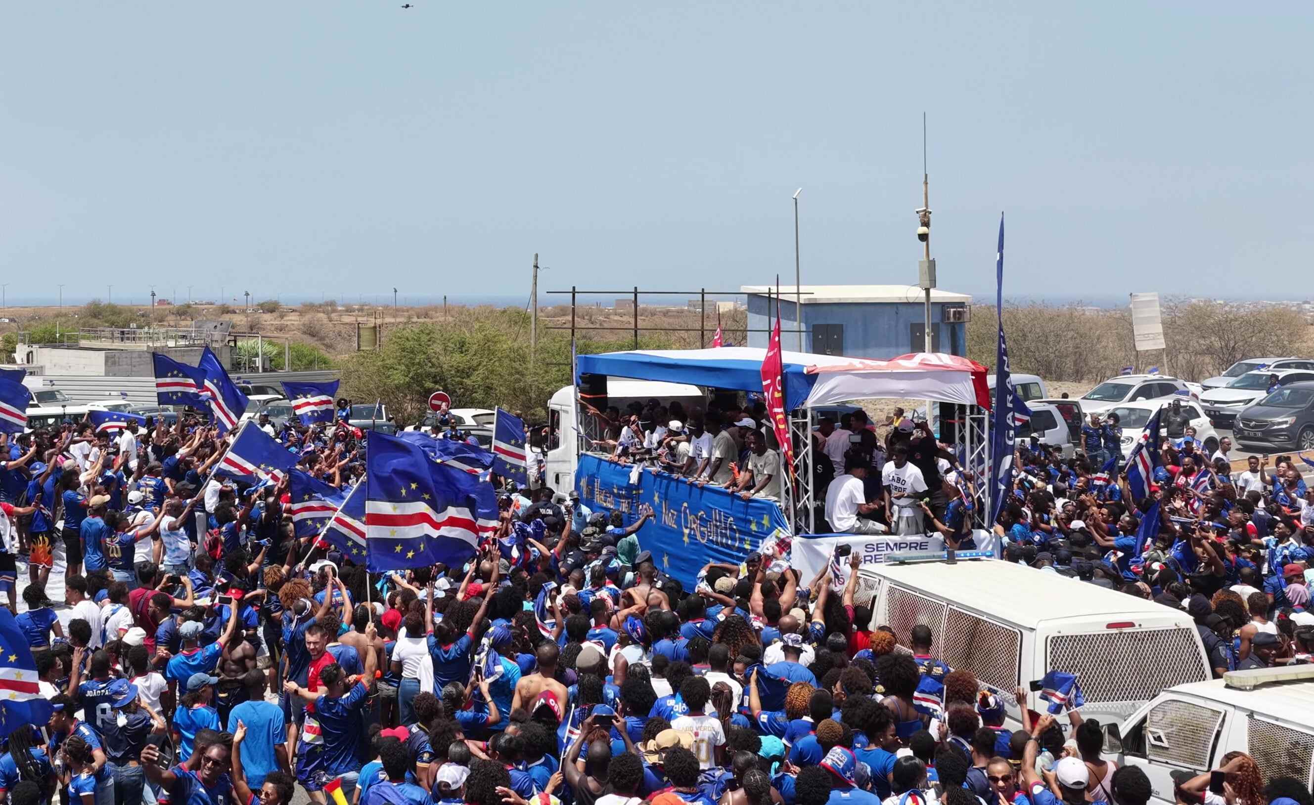 Fans run alongside the bus for Cabo Verde’s national football team after its heroic World Cup run. Photo: AP