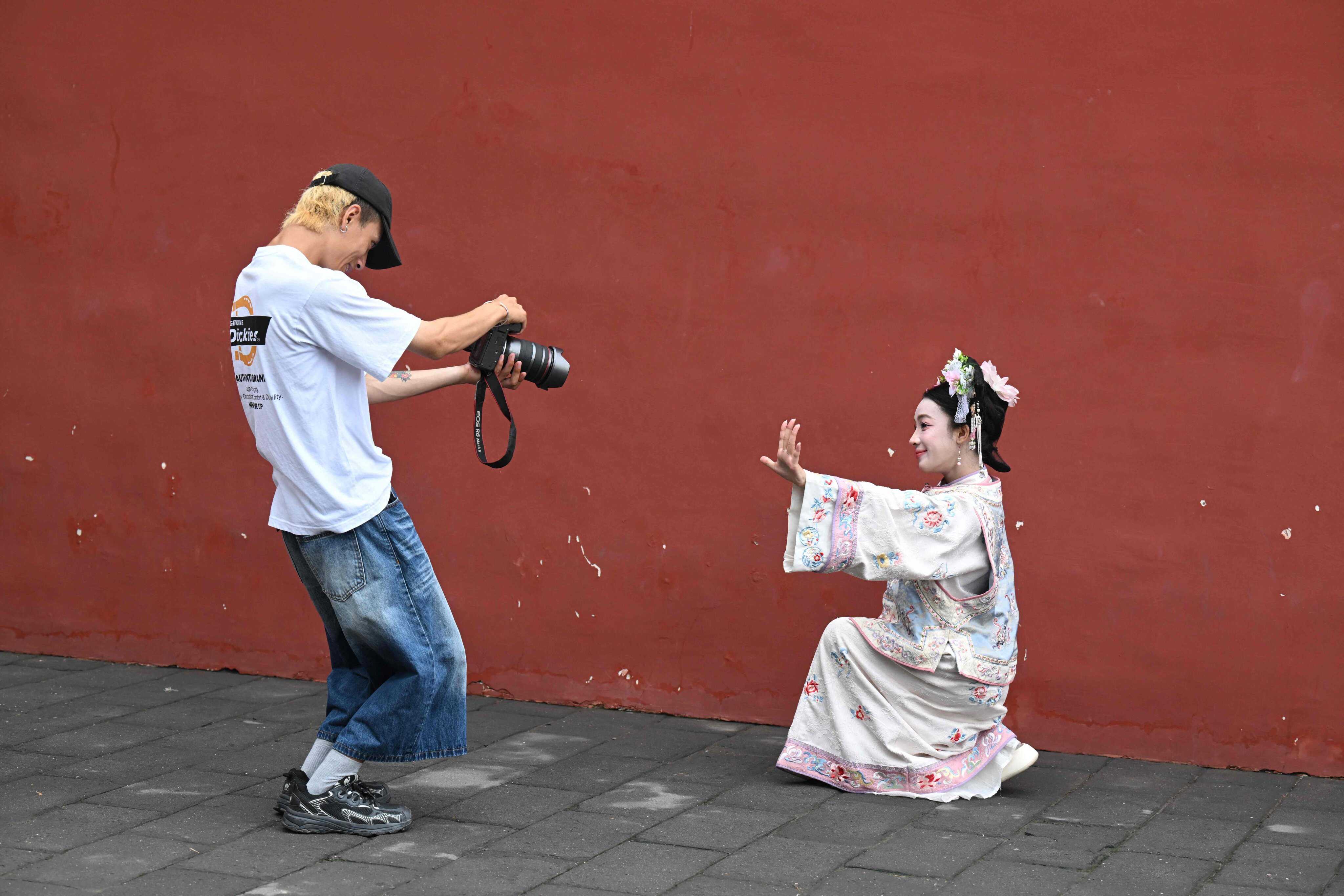 RedNote is boosting domestic tourism in China, with photographers competing at scenic spots, such as a lake in Beijing’s Shichahai area that is popular for traditional dress photos. Photo: AFP