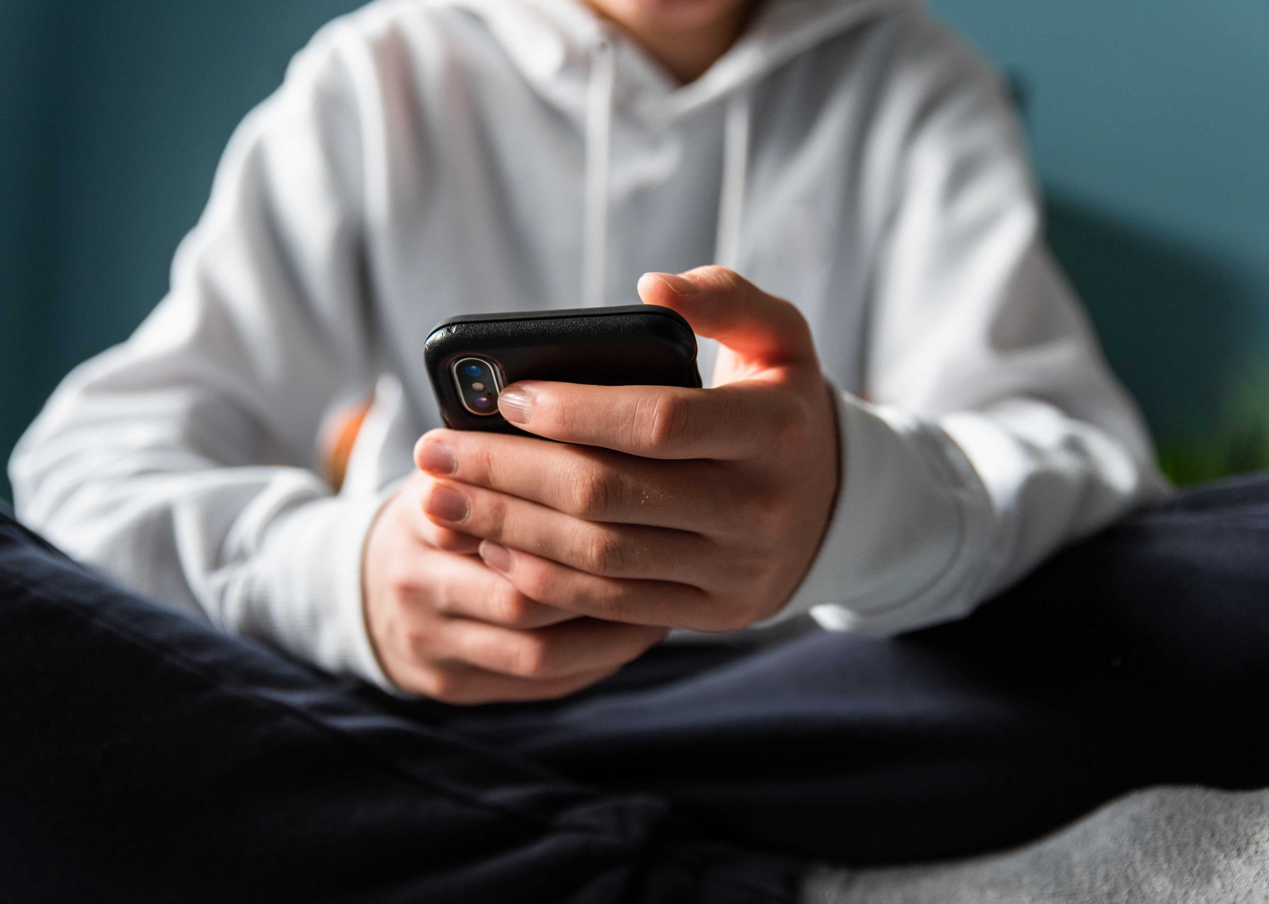 Texting and scrolling too much can hurt your thumbs, so make sure to switch up your posture. Photo: Getty Images