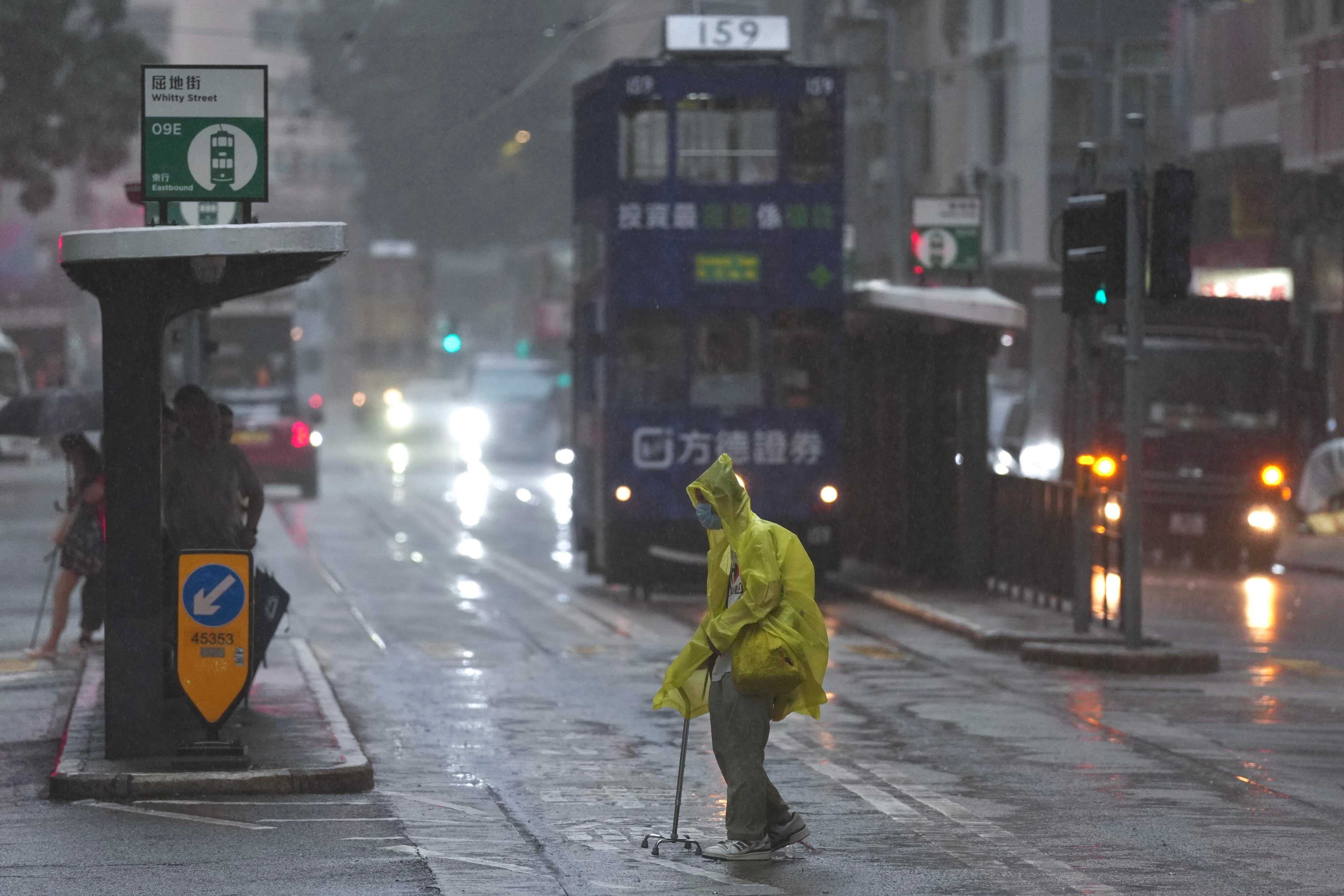 Hong Kong’s red rainstorm warning downgraded to amber, but unsettled weather persists. Photo: Karma Lo