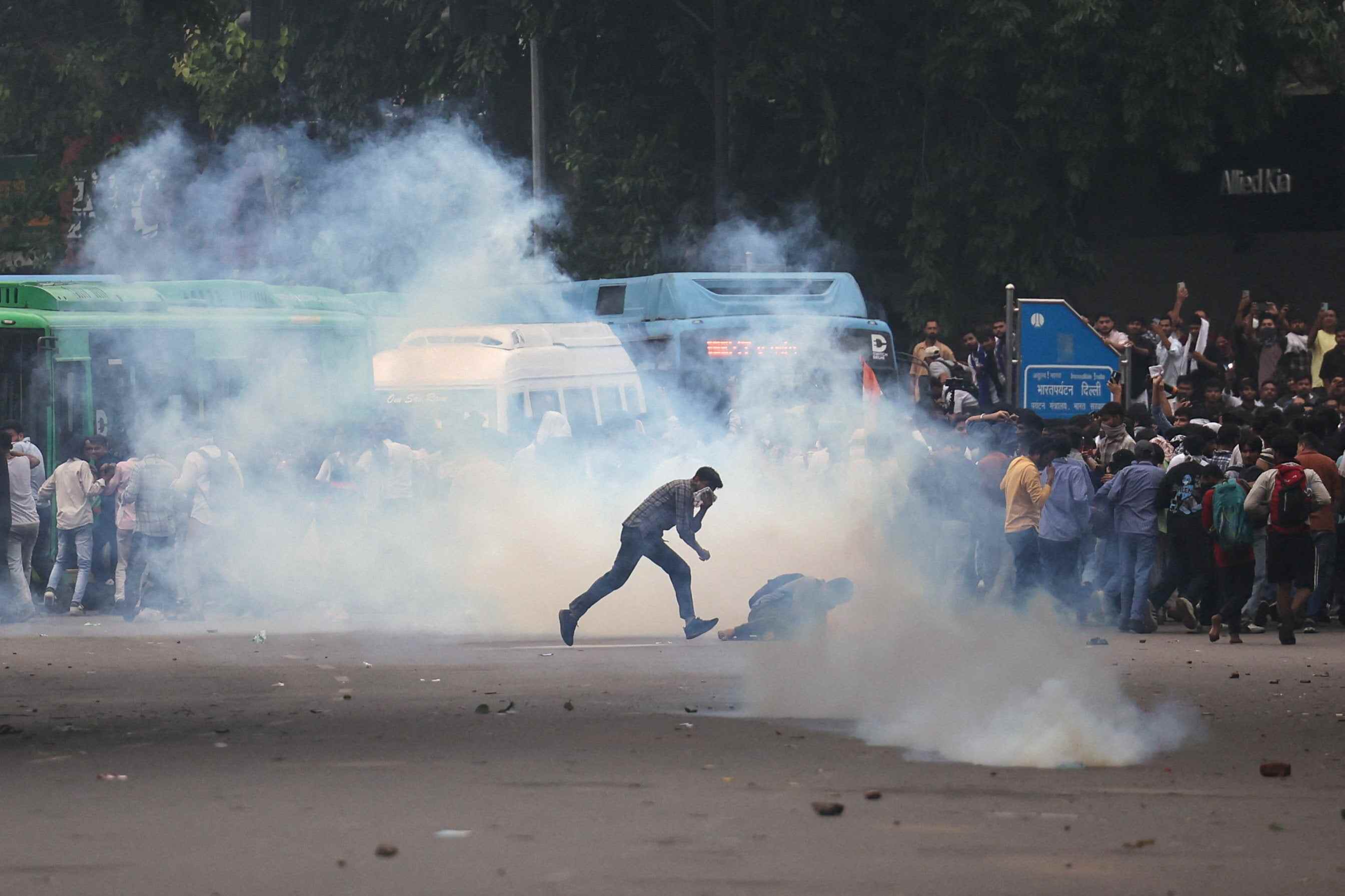 Tear gas spreads around protesters as supporters of India’s Cockroach Janta Party demonstrate on the opening day of the Indian parliament’s monsoon session, demanding the resignation of Education Minister Dharmendra Pradhan over exam paper leaks, in New Delhi, India. Photo: Reuters