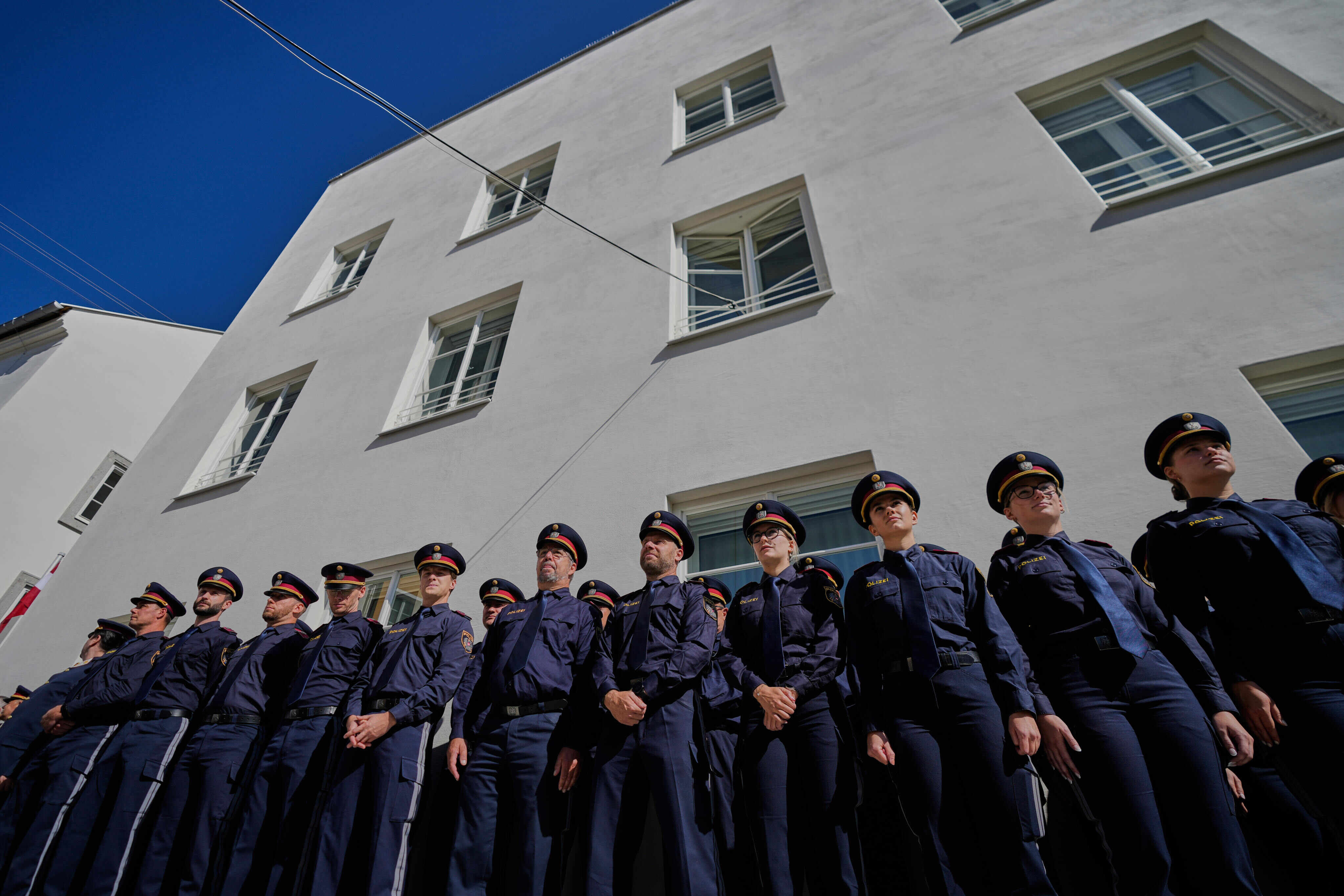 Police officers stand outside a new police station located in the building where Adolf Hitler was born. Photo: Reuters
