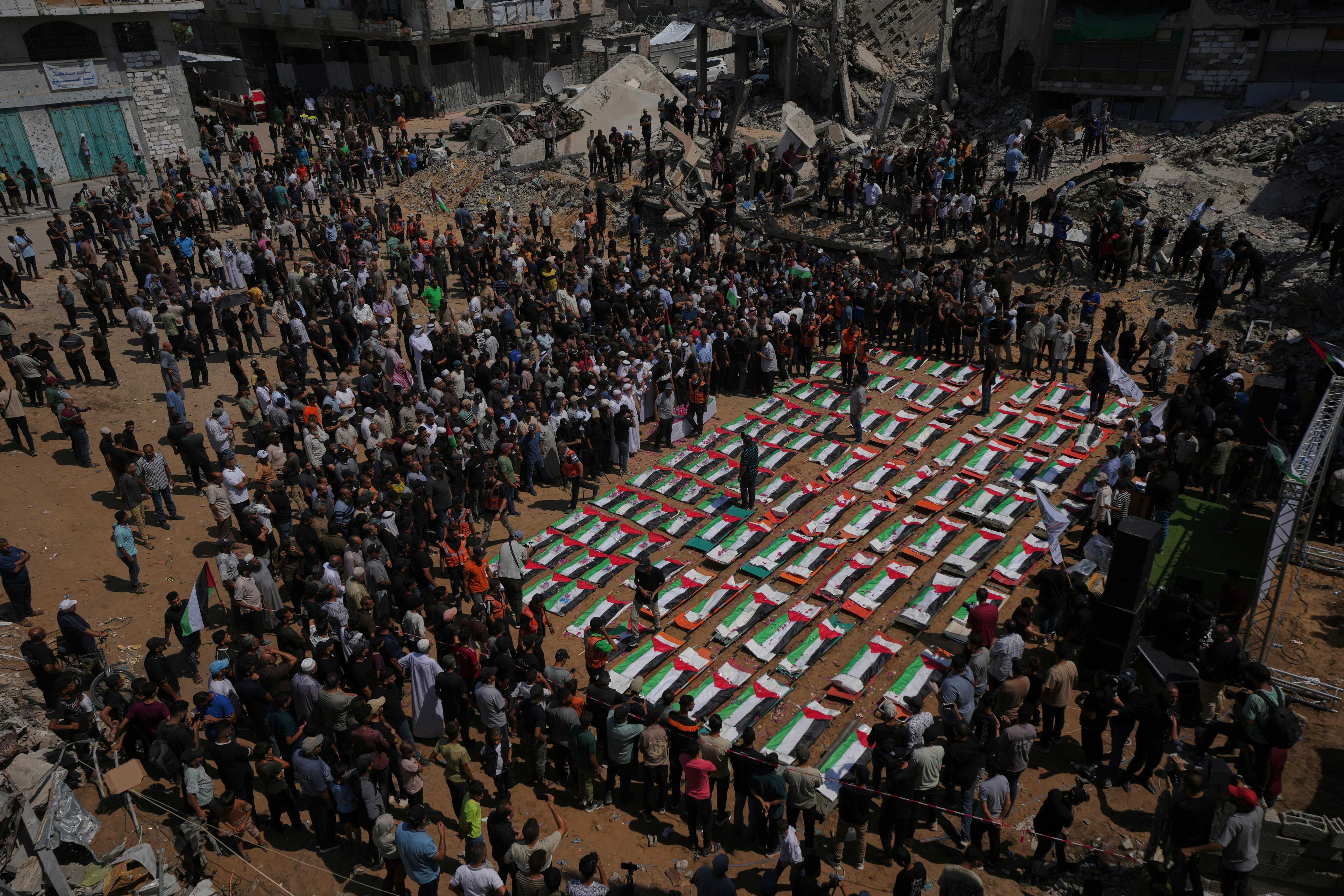 Bodies of members of the Hassayna and Abu Sharia families, killed in an Israeli strike in 2023 and recently recovered from the rubble, are draped in Palestinian flags during their funeral in Gaza City. Photo: AP