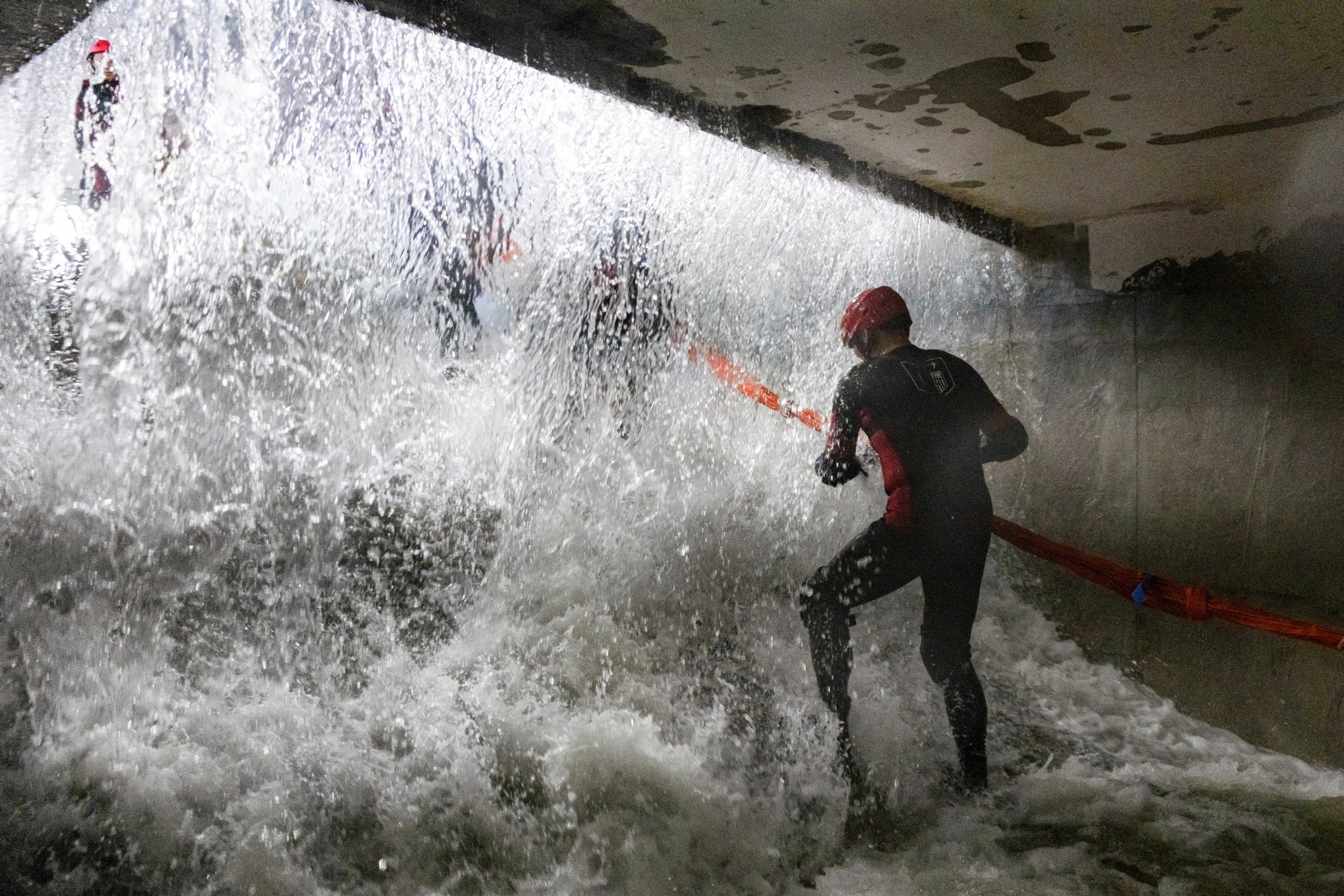 Participants practise evacuating an underground facility during a typhoon survival training session at the Lvxing Disaster Simulation Training Centre in Hangzhou, China. Photo: Reuters