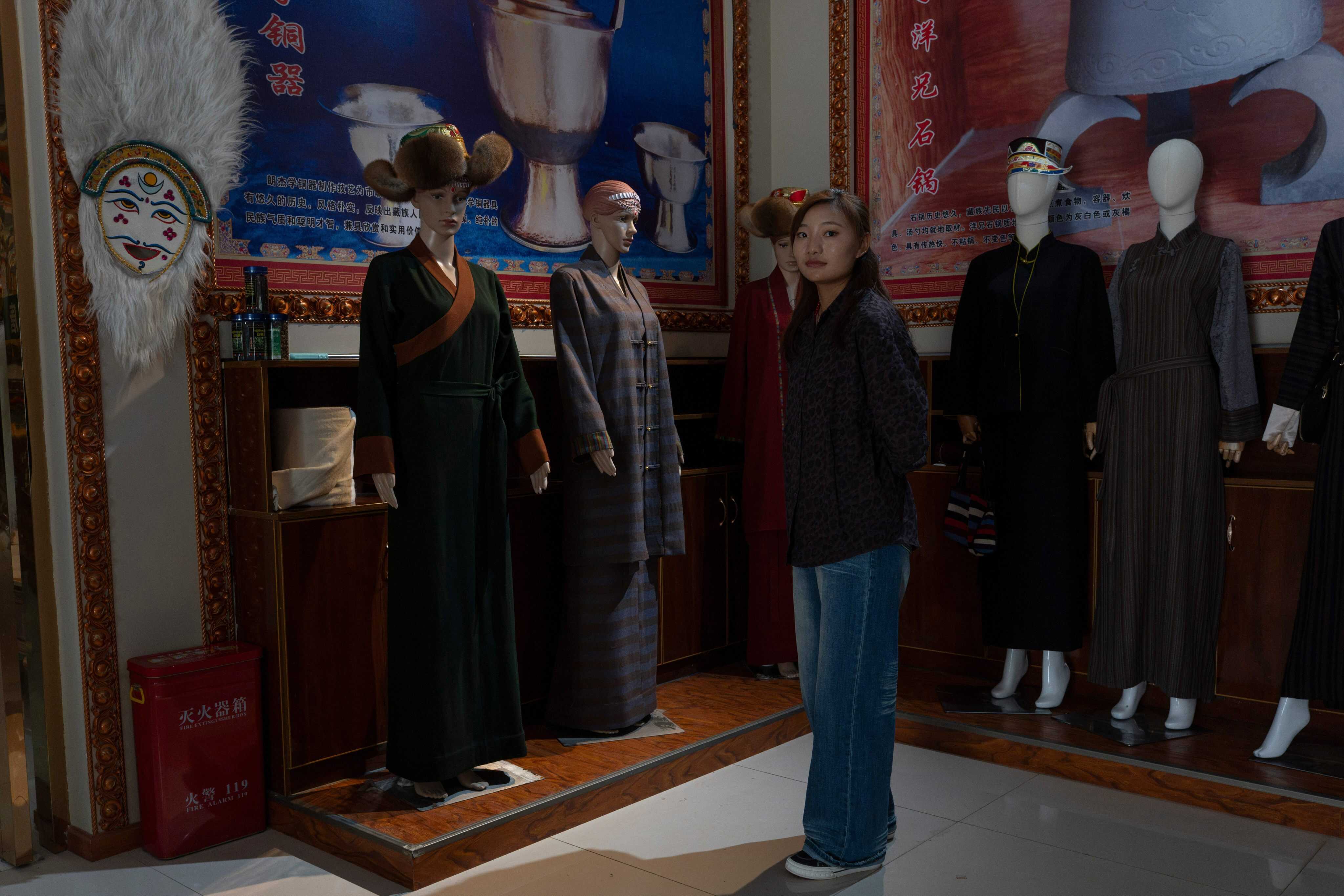 A worker stands near items at the Ethnic Huaji Handwoven Cooperative in Shannan, in western China’s Tibet Autonomous Region. Photo: AP