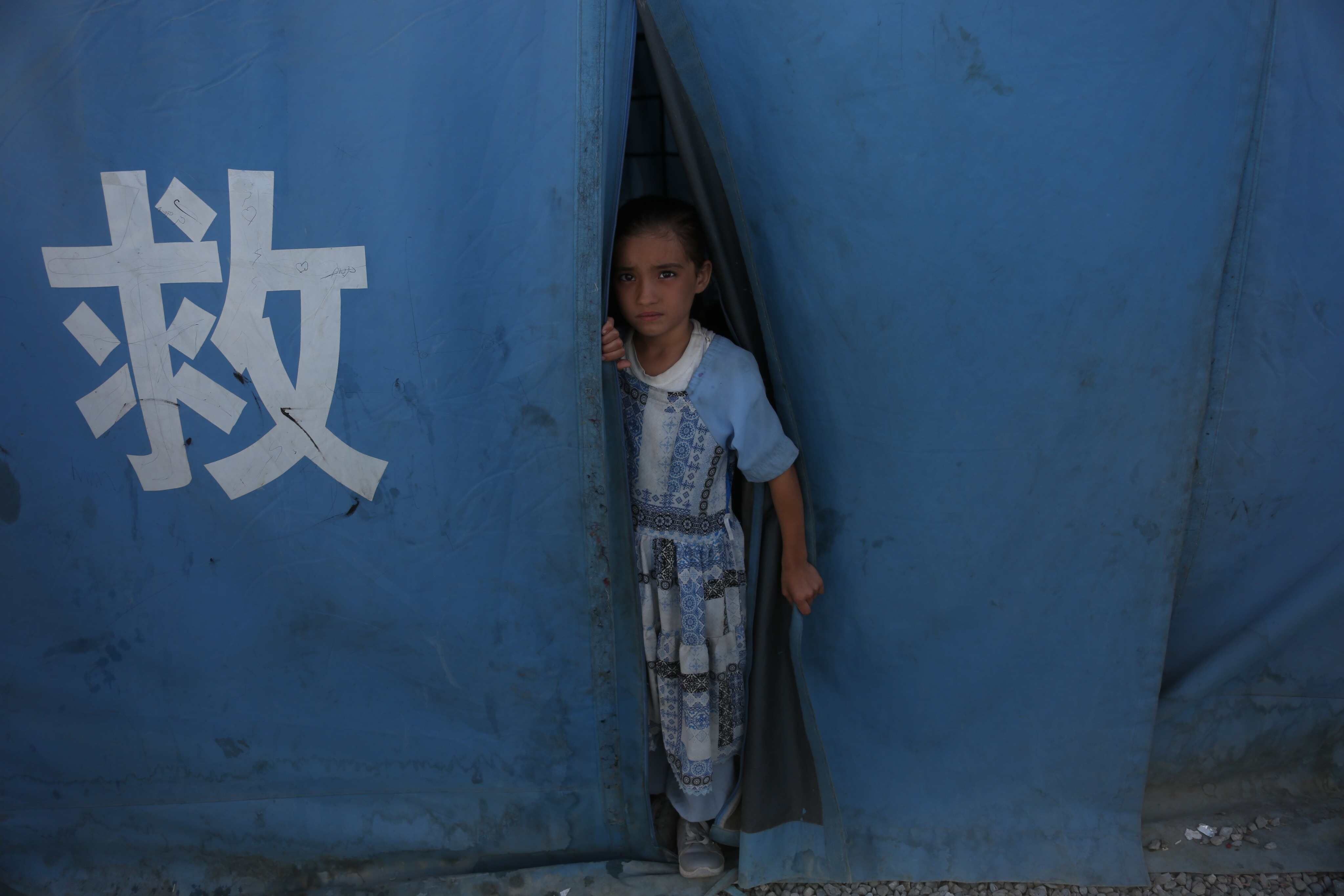 A child is seen from a tent provided by China in Kabul, Afghanistan, in November 2025. Photo: Xinhua