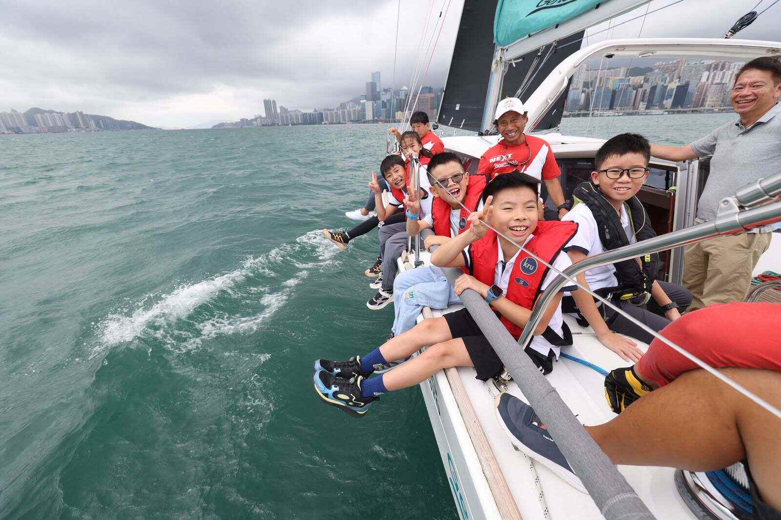 Thanks to a charity initiative, about 60 young people and their family members have had the experience of sailing along Victoria Harbour. Photos: Nora Tam