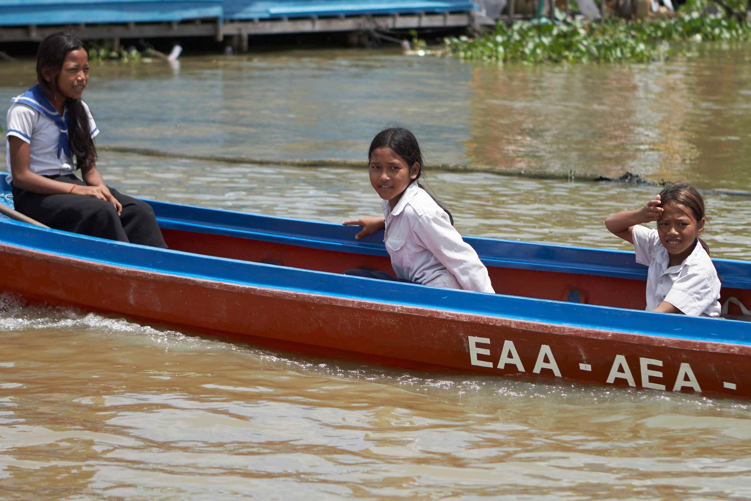 Sou Sreynich, 13, returns home from school on Cambodia’s Tonle Sap Lake. Photo: AP