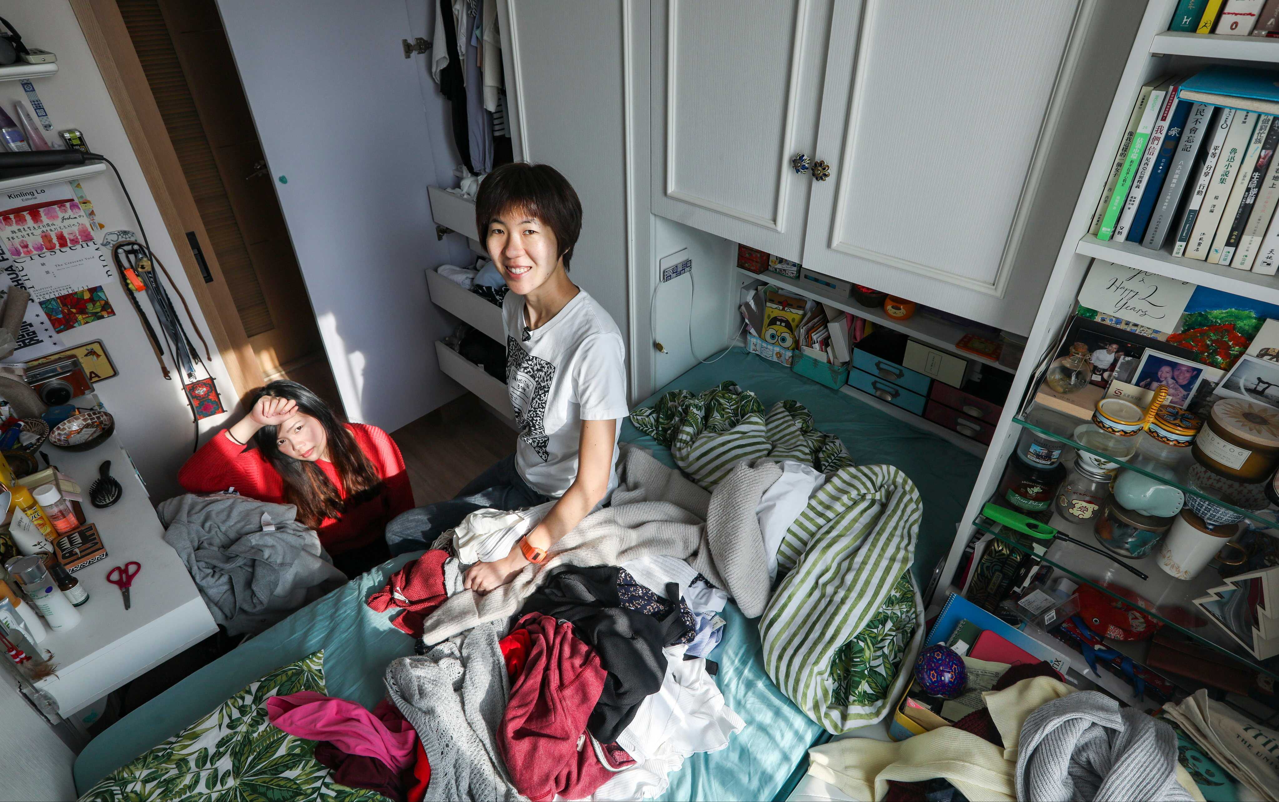 Professional organiser Orange Tam (right) helps Kinling Lo declutter her closet at home in Tai Wai. Photo: Xiaomei Chen