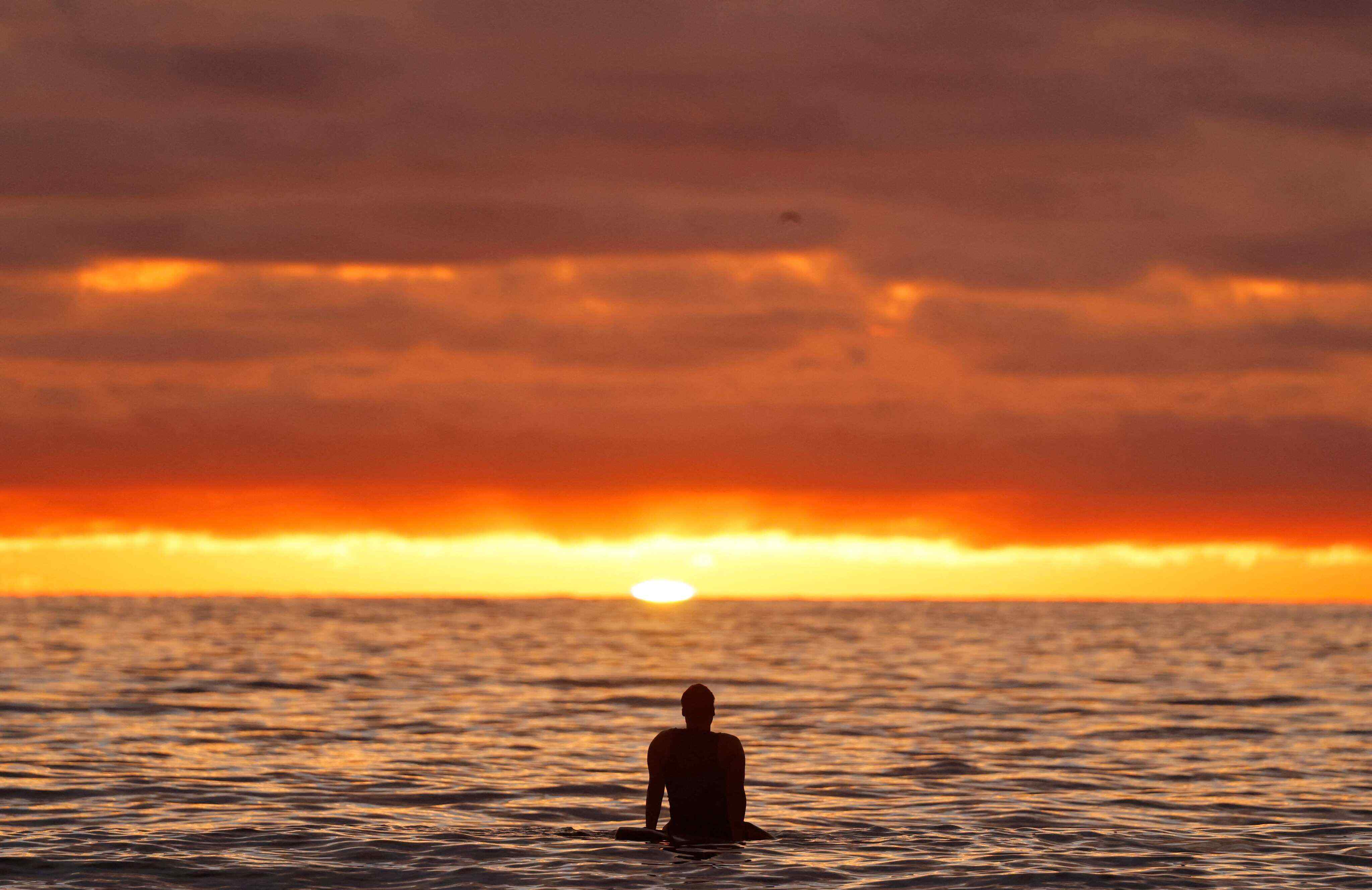 A surfer in the Pacific Ocean off San Diego, where global sea surface temperatures have risen. Photo: AFP
