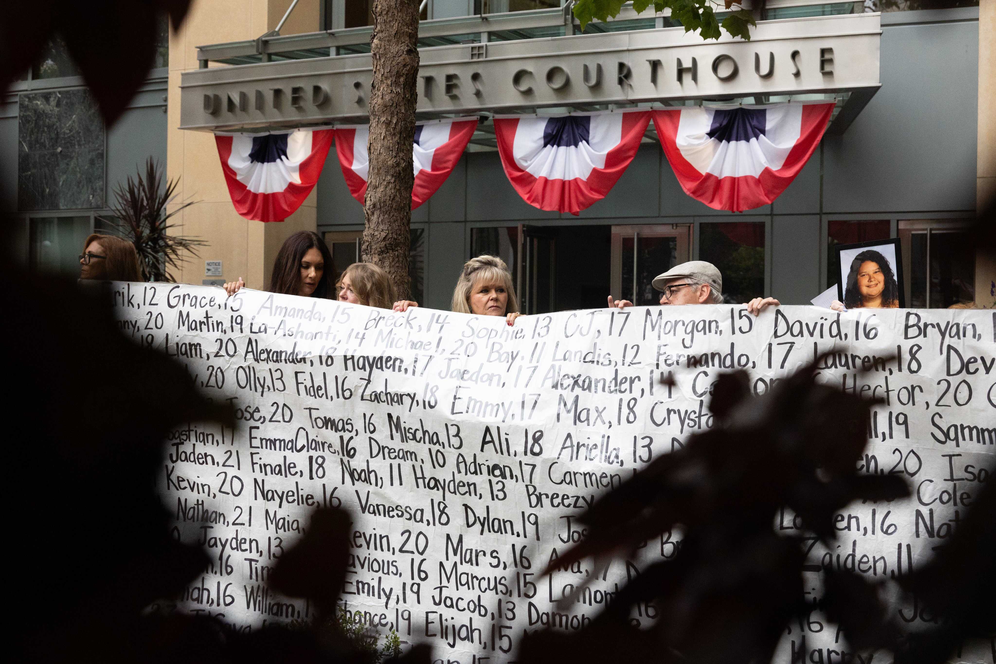 Family and advocates of young people that allegedly died from the effect of social media stand outside the US Courthouse in Oakland, California, where the Meta trial took place. Photo: TNS