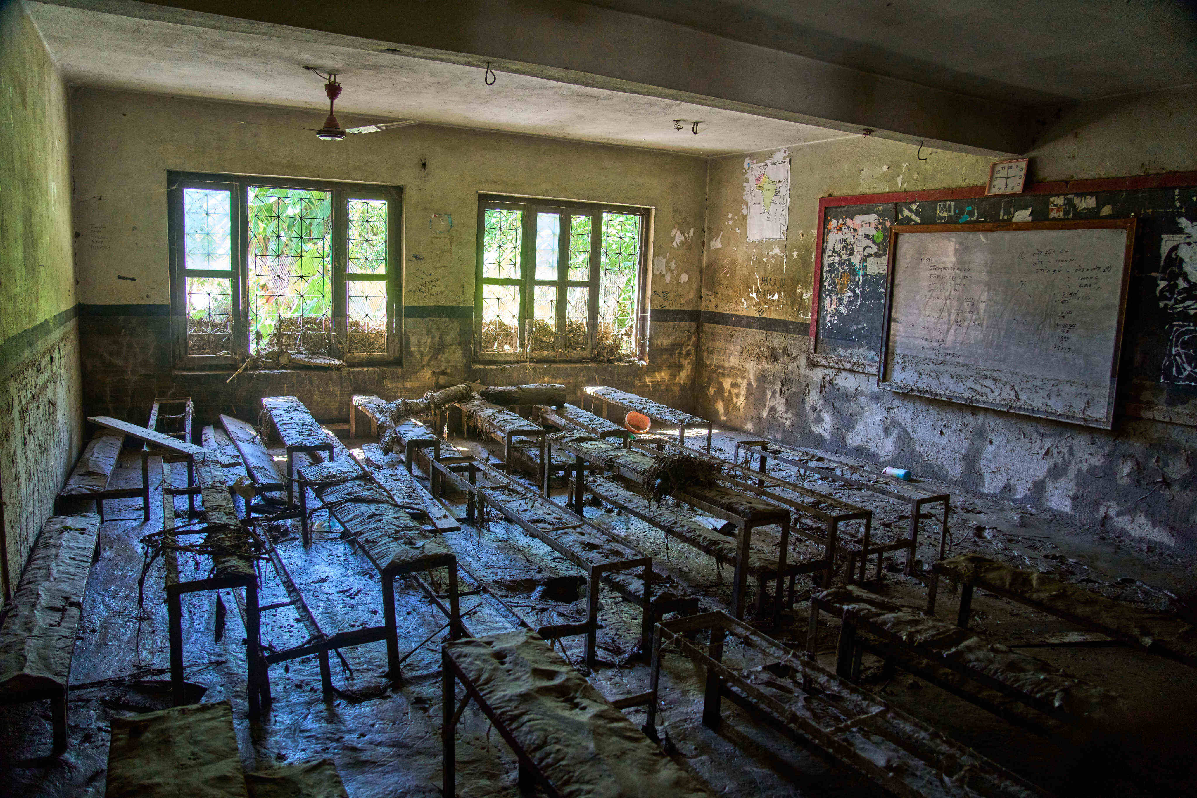 Mud covers a classroom at Shree Bagheswori Madhyamik School, which was damaged by flooding in the Dhading district of Nepal on August 30. Photo: AP