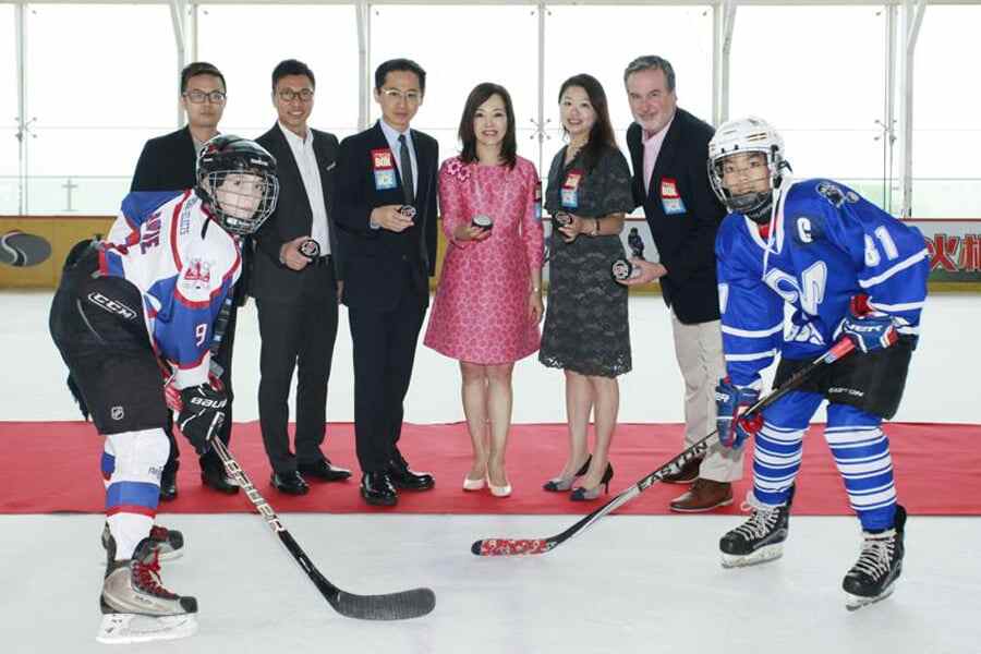 Players and officials at the Mega Ice 5's Youth Division puck drop ceremony.