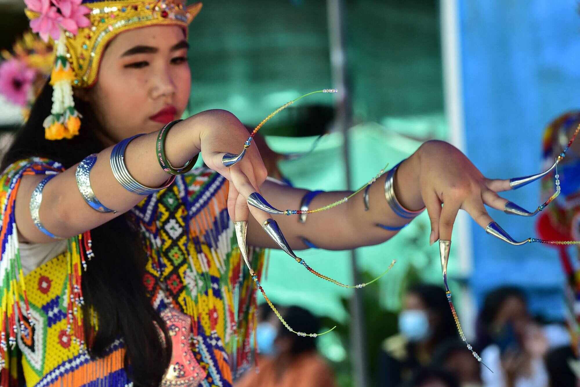 Nora dancers wear long detachable nail tips to emphasis finger movements. Photo: AFP 