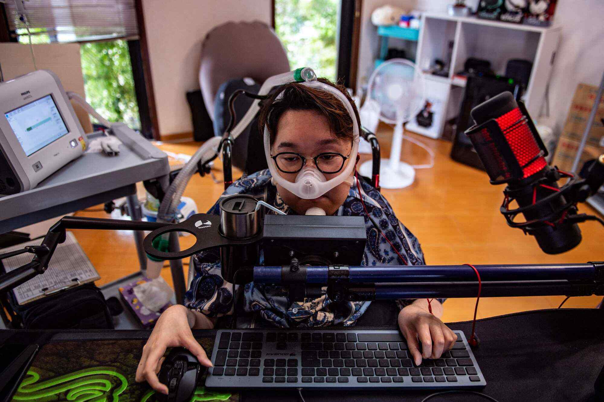 Shunya Hatakeyama and a friend designed a custom controller he could use with his chin. Photo: AFP