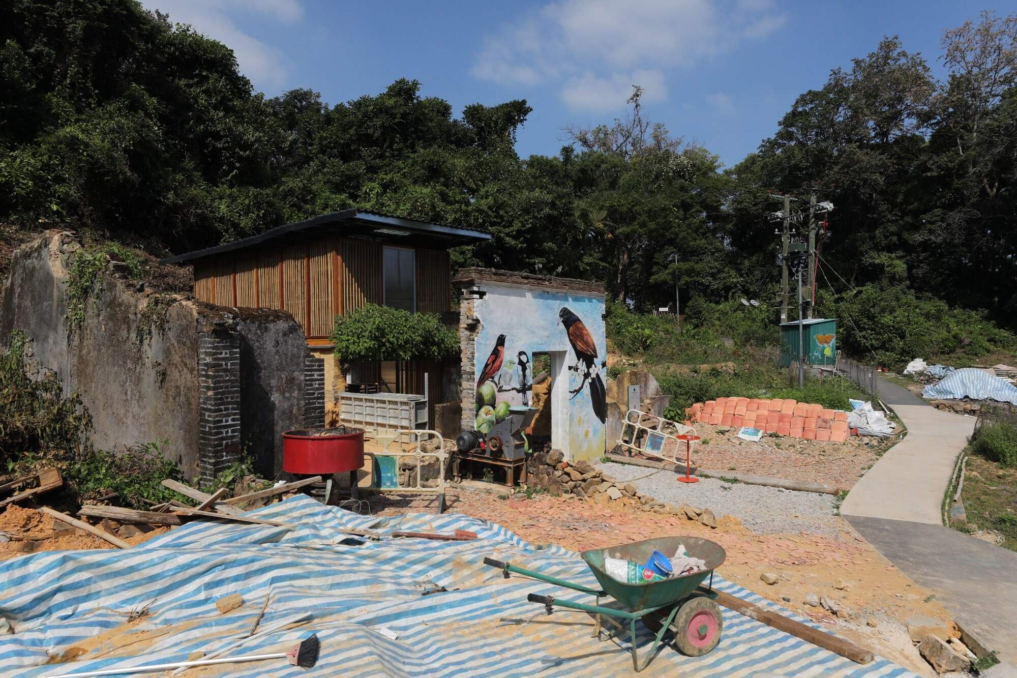 An ancient house is being remodeled and decorated with a mural in Mui Tsz Lam. Photo: Xiaomei Chen
