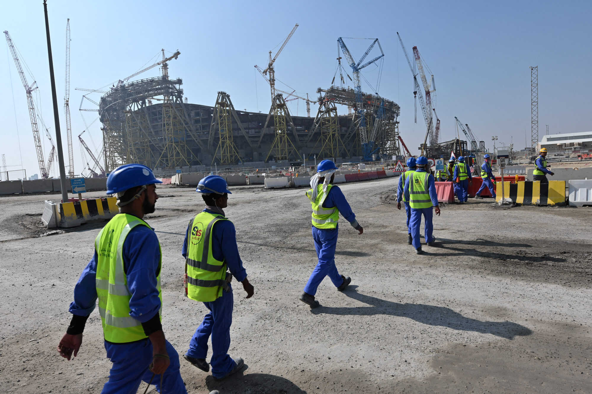 Average high temperatures in Qatar exceed 37.7 degrees Celsius for five months of the year. Construction workers are at risk of accidents and heat-related illnesses. Photo: AFP