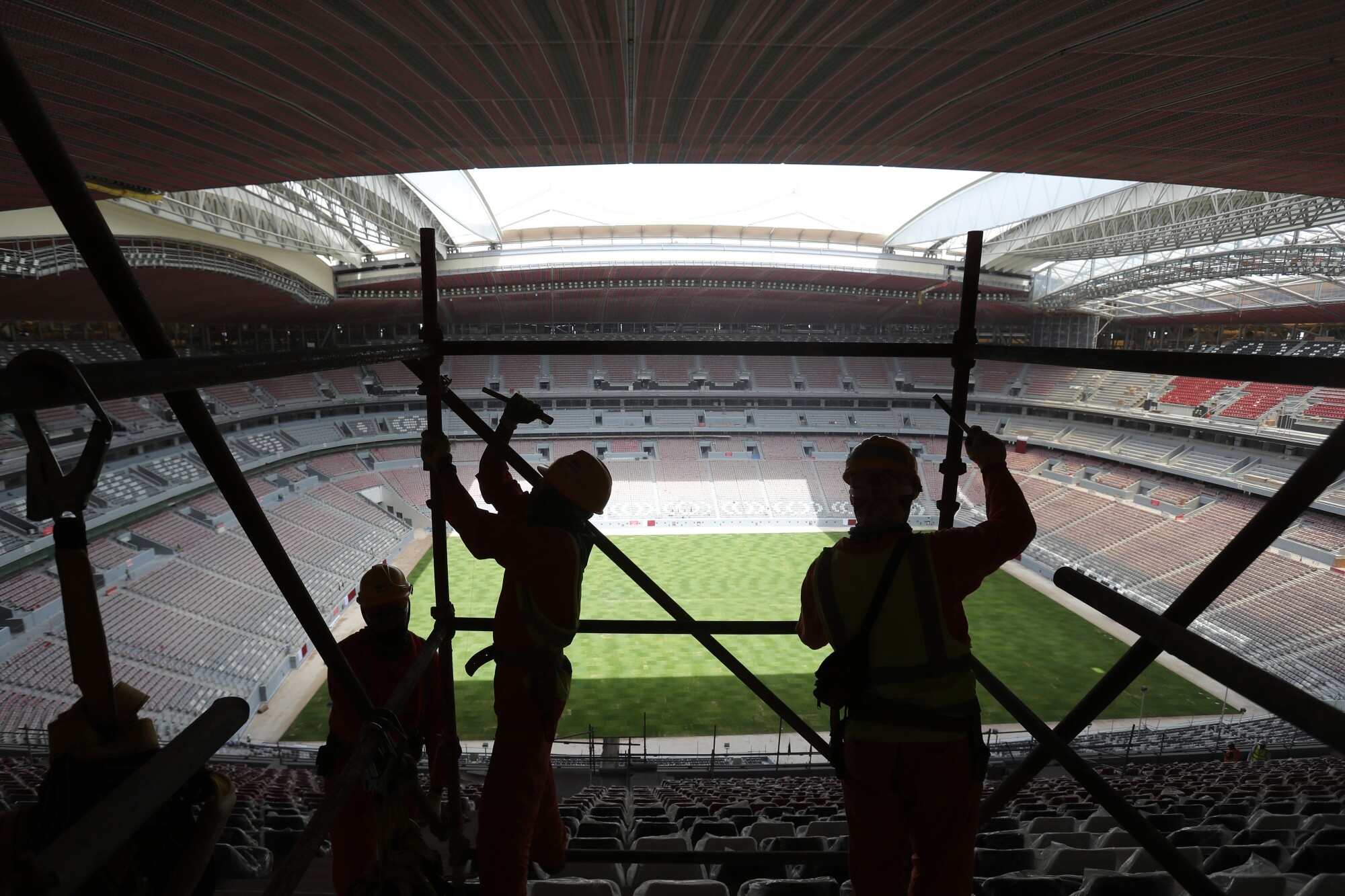 Migrant labourers who built Qatar’s World Cup stadiums often worked long hours under harsh conditions and were subjected to wage theft and other abuses, Amnesty International said in a report. Photo: AP