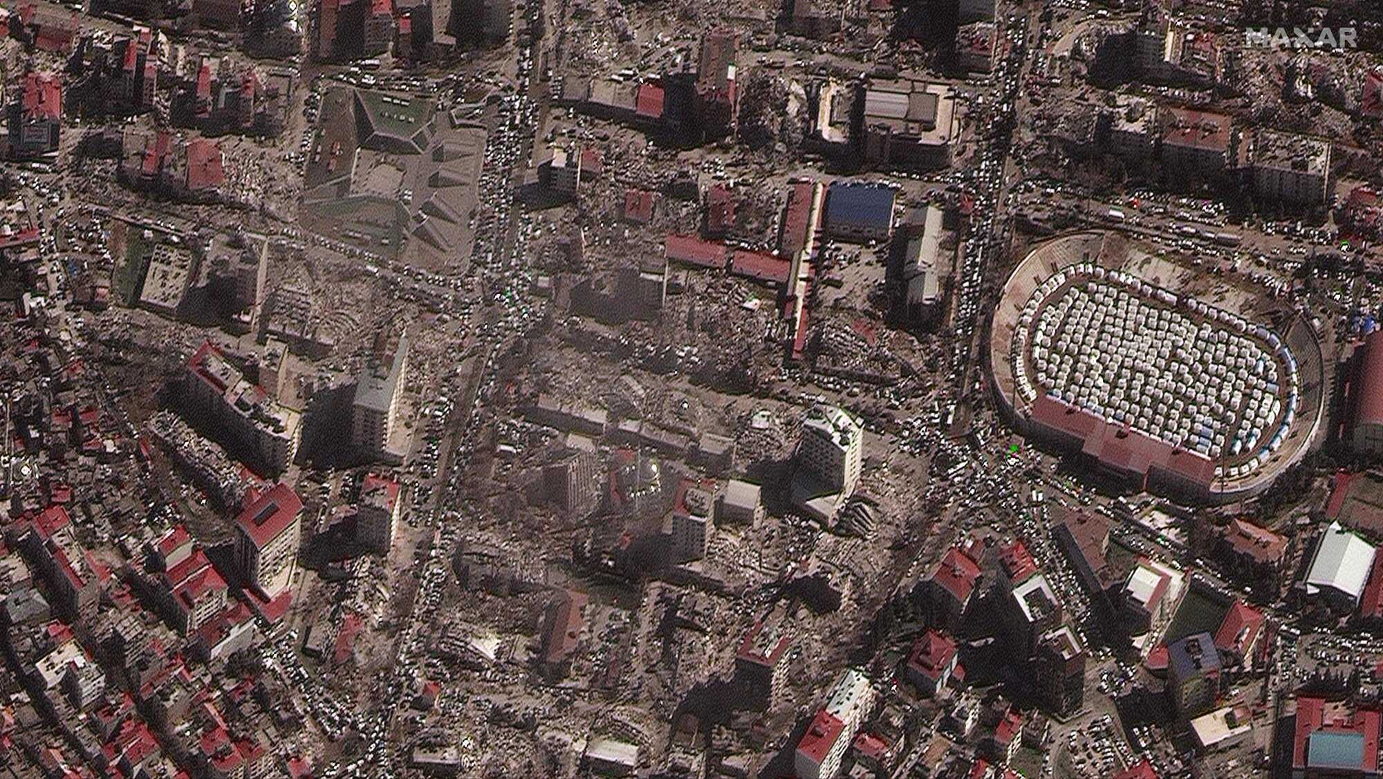 This handout satellite image courtesy of by Maxar Technologies shows destroyed buildings and emergency shelters in a stadium in Kahramanmaras, Turkey on February 8, 2023, after an 7.8 magnitude earthquake which struck the region on February 6, 2023. Photo: AFP/Satellite image ©2023 Maxar Technologies