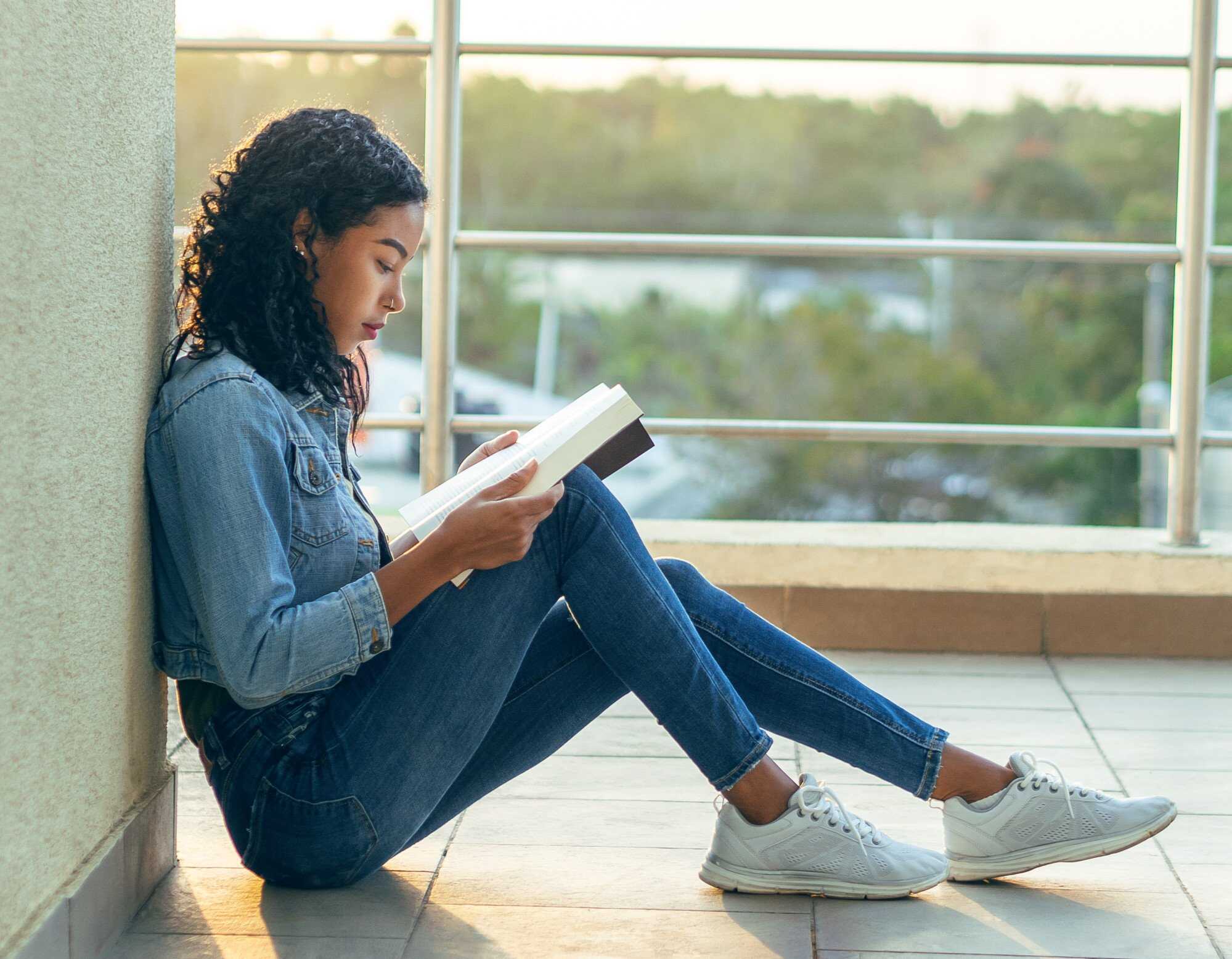 Put down your phone and pick up a book to ease your anxiety. Photo: Shutterstock