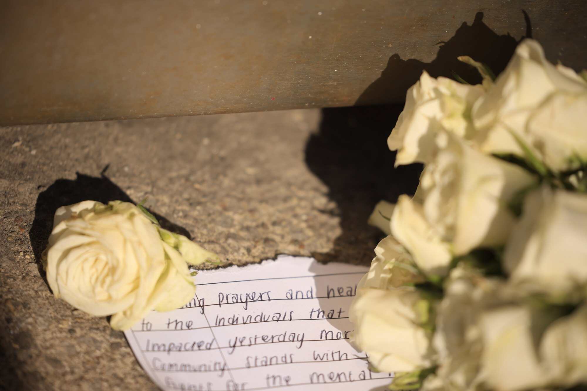 A note left by a mourner in the aftermath of a mass shooting which left at least five people and the gunman dead at Old National Bank in downtown Louisville, Kentucky. The workplace shooting also injured at least eight other people, including a Louisville police officer who responded to the scene. Photo: EPA-EFE