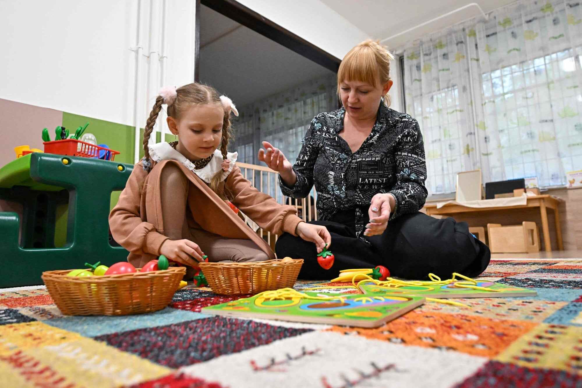 Olena Andriichuk works with a patient in Budapest. Photo: AFP