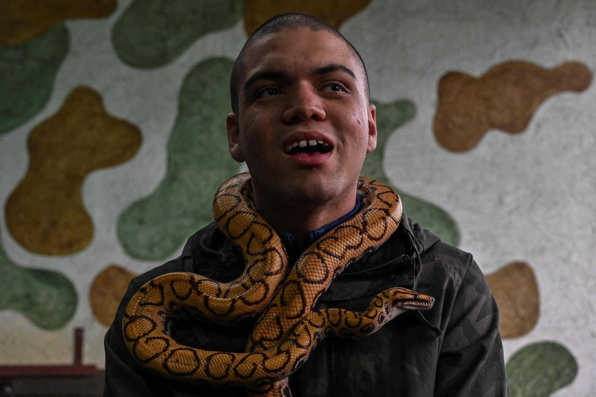 David de Oliveira Gomes attends a therapy session at the Walking Equotherapy Clinic. Photo: AFP